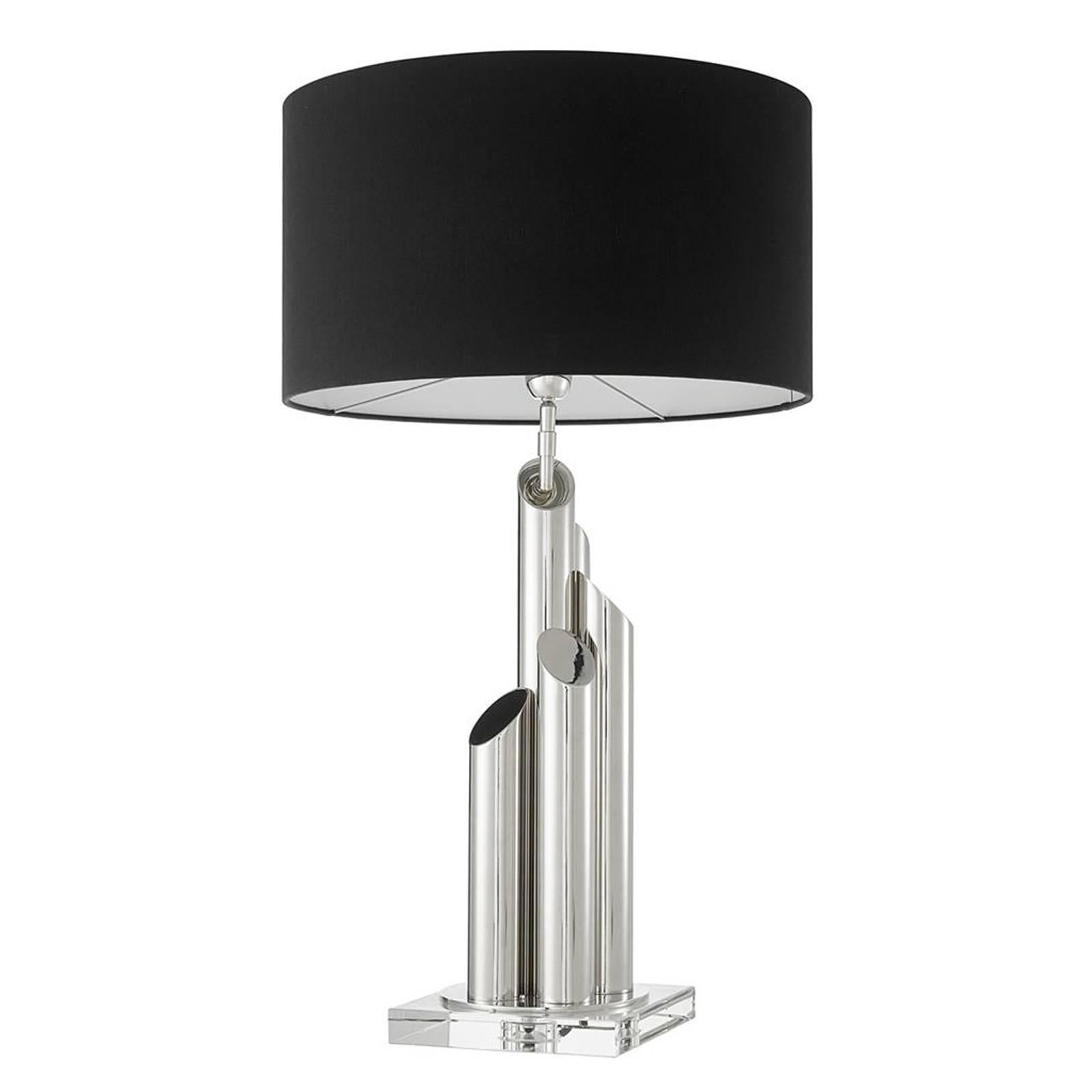 Table Lamp Tubes Nickel with structure in nickel
finish and with black shade included. on Crystal 
Glass Base. 1 bulb, lamp holder type E27, max
40 watt. Bulb not included.
