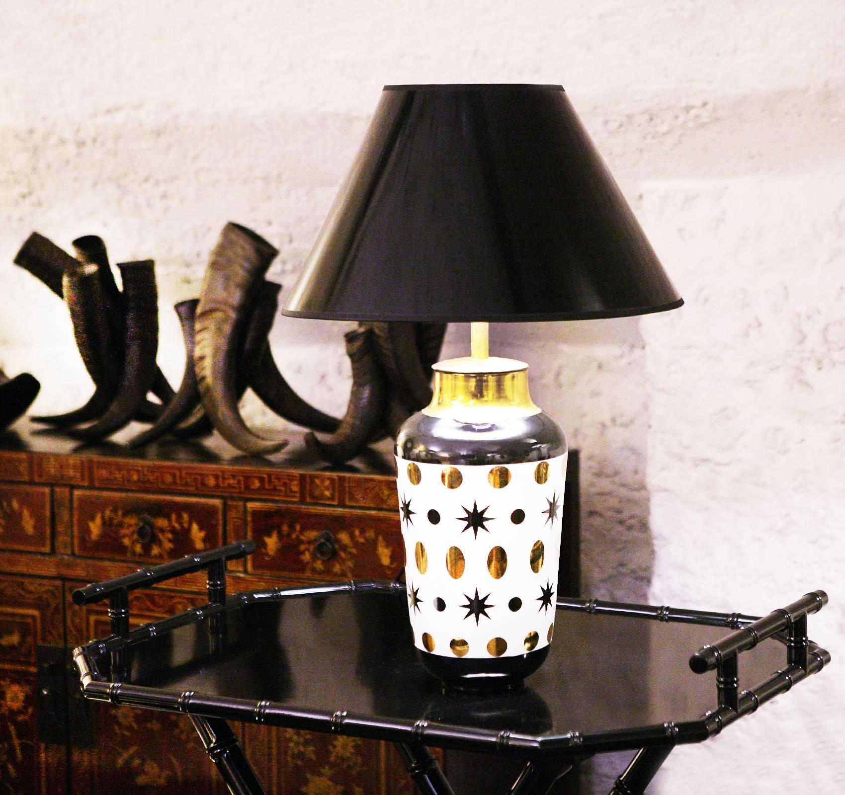 Table Lamp Black Stars in hand-crafted porcelain
with gilded rings. Including black shade. Bulb not
included. Made in France in 2015. Exceptional piece.
