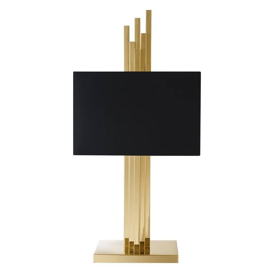 Table lamp Strada with structure in gold finish.
With black shade. Two bulbs, lamp holder type E27,
max 40 watt. Bulbs not included. Also available in
nickel finish.
