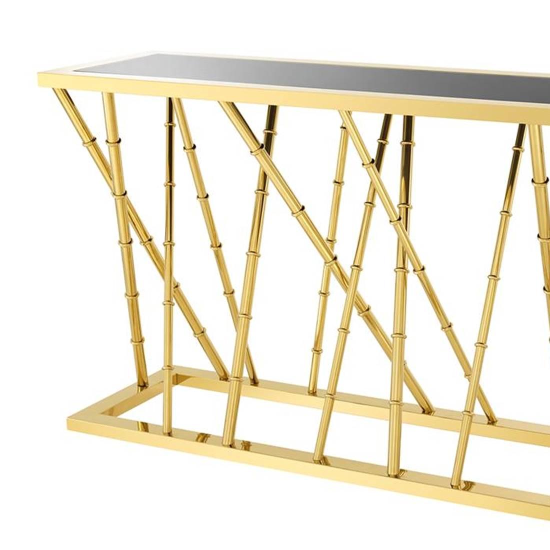 Console table gold bamboo with polished stainless
steel structure in gold finish. With black glass top.
 