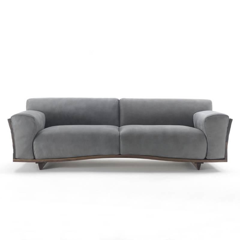 Sofa extreme wood with structure in hand-carved, hand-polished,
hand-patinated solid walnut wood. Subtle wood work upholstered
and covered seat, back and armrests with high quality genuine grey 
leather Cat D4. 
Also available with structure in