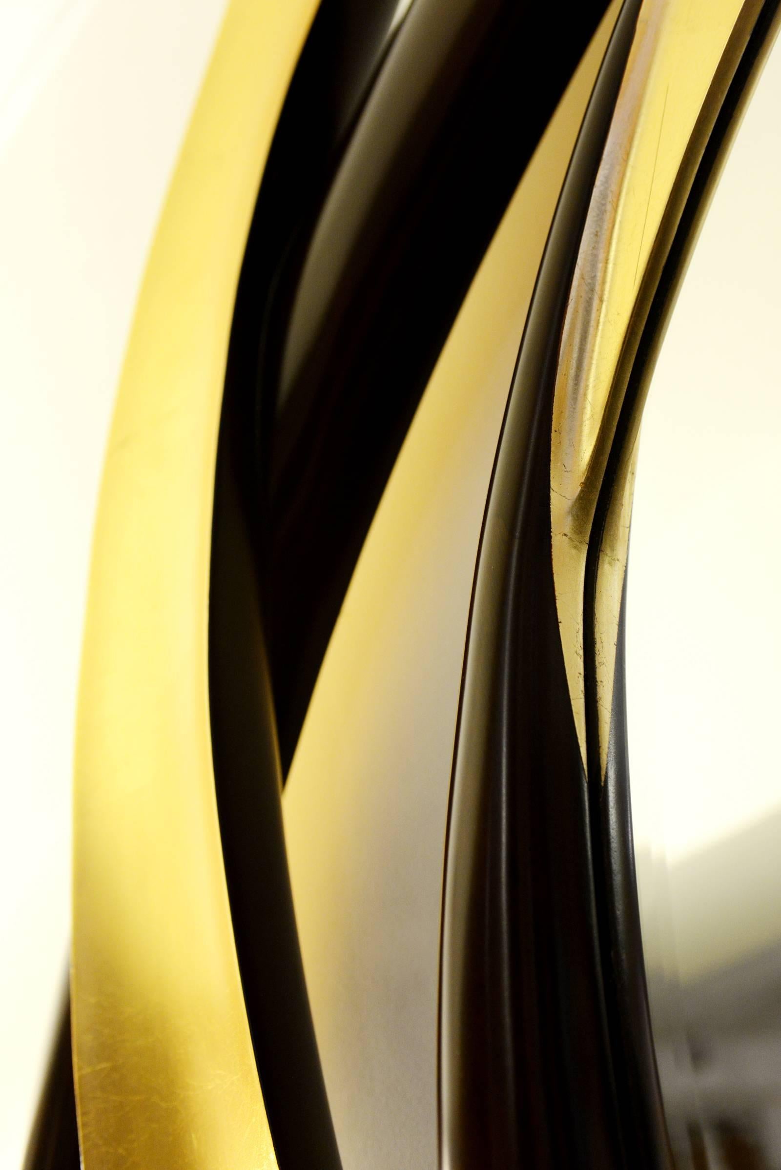 Miroir cercles dorés en bois d'acajou finition dorée Excellent état - En vente à Paris, FR