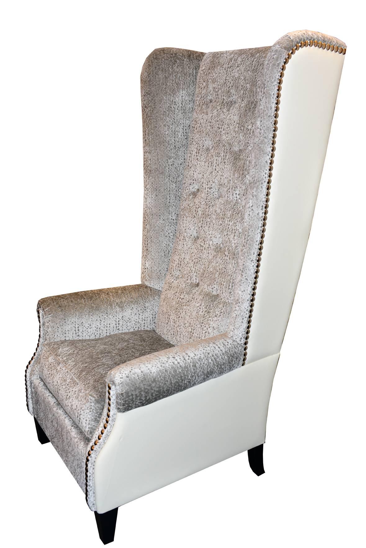 Greenwich armchair with Atlanta fabric and back in tango cream.
Genuine leather, silver chrome tacks and black lacquered feet. 
Set of two available, price: 19800,00€
.
