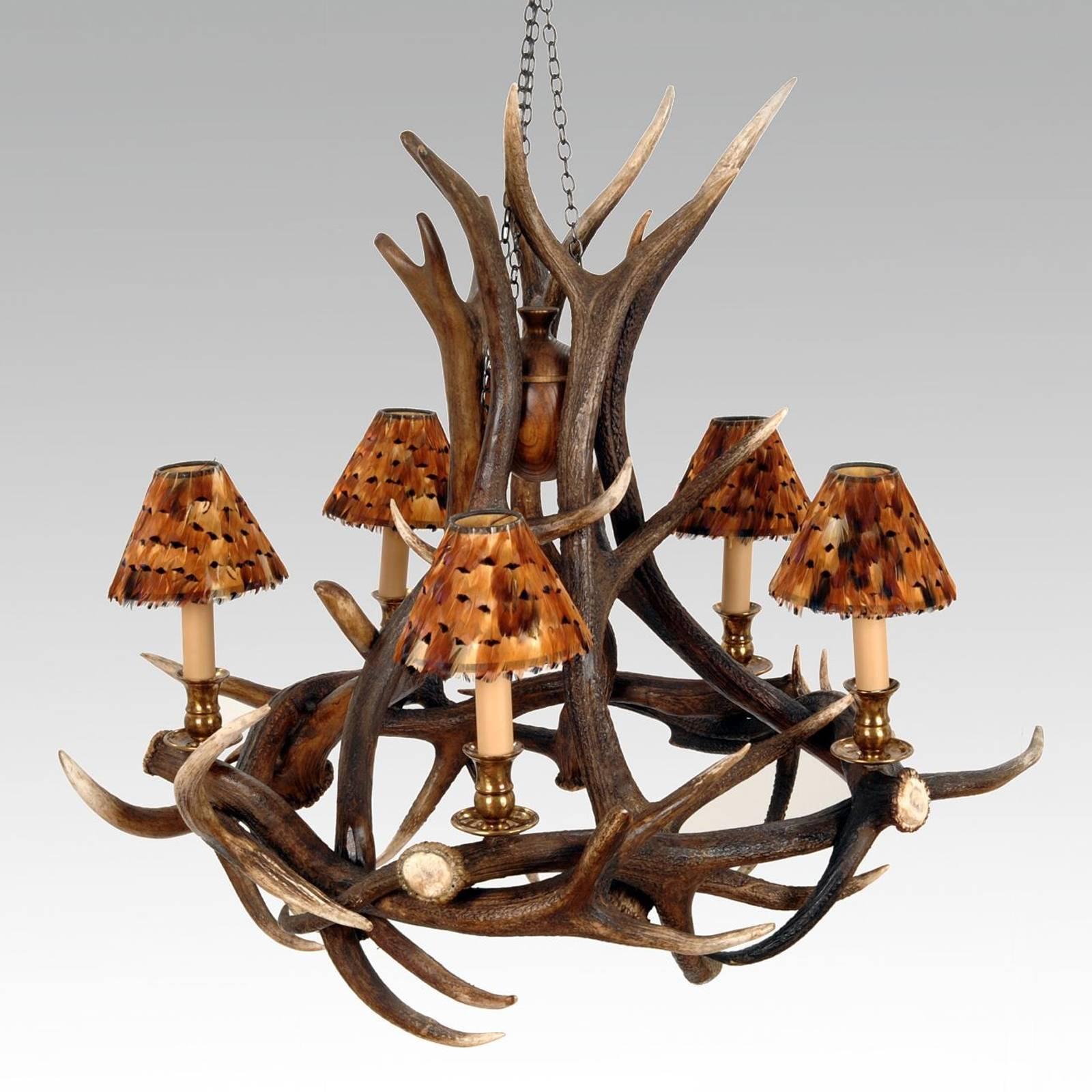 Chandelier five deer with five deer antlers, with vintage
brass finish, five bulbs and five partridge feather lampshade.
