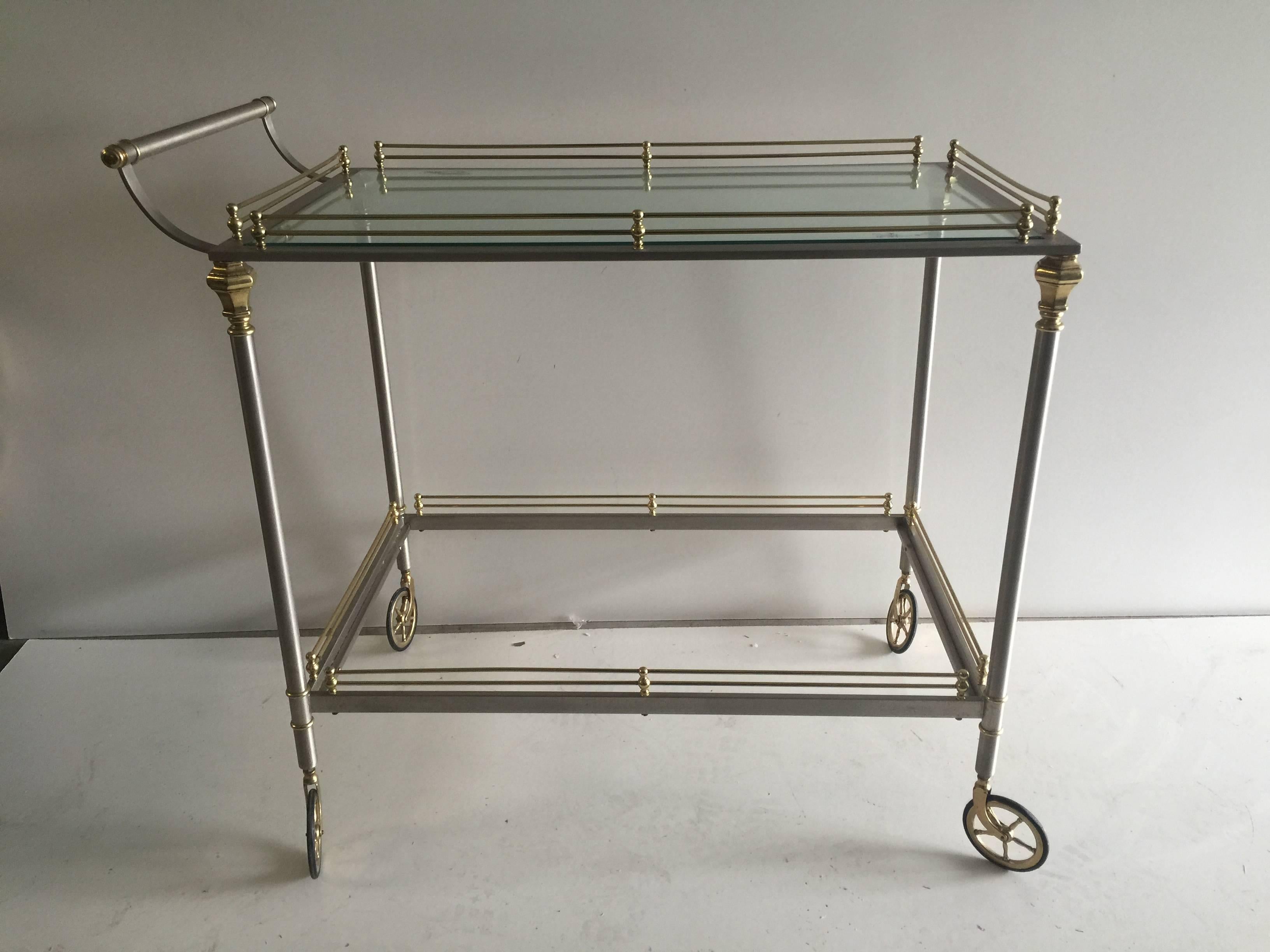 An exceptional French bar cart in polished steel and brass 
