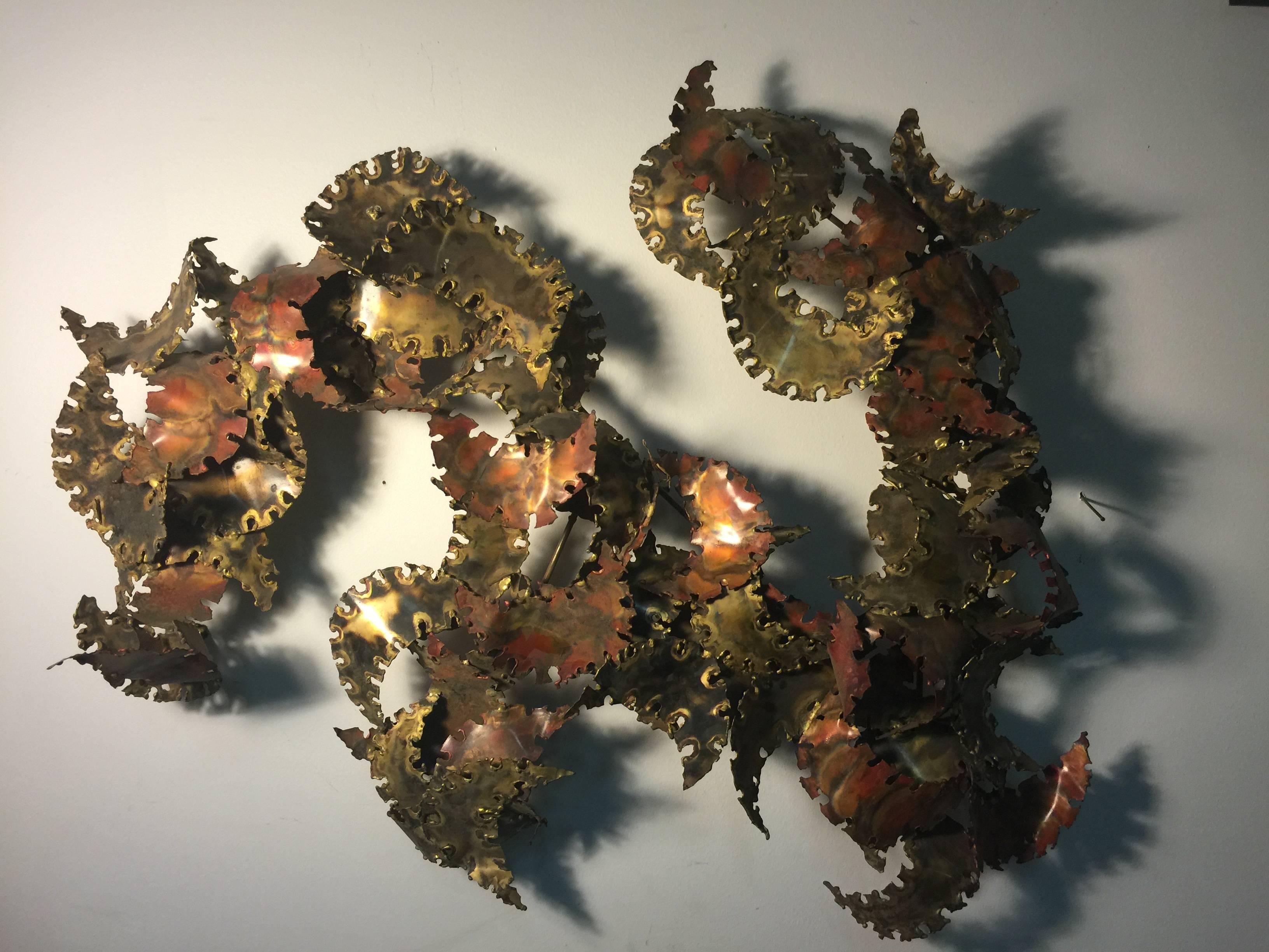 An amazing torch cut wall-mounted abstract sculpture by Silas Seandel, circa 1970. Great design and patina.