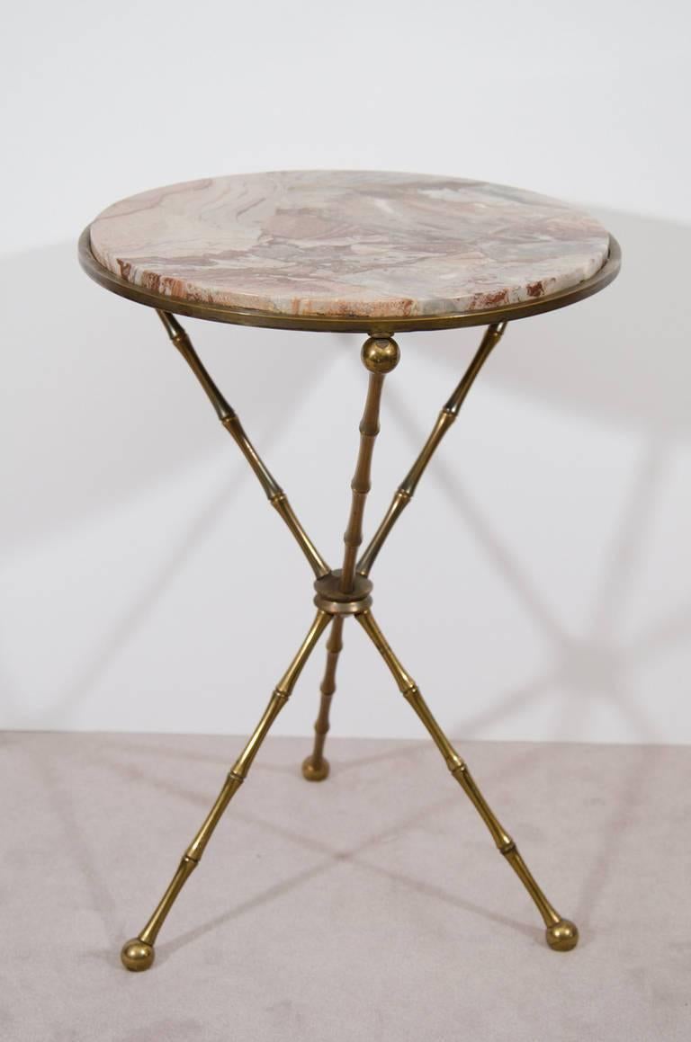 A fantastic pair of Italian cocktail or side tables with marble tops and faux bamboo bronze tripod bases.