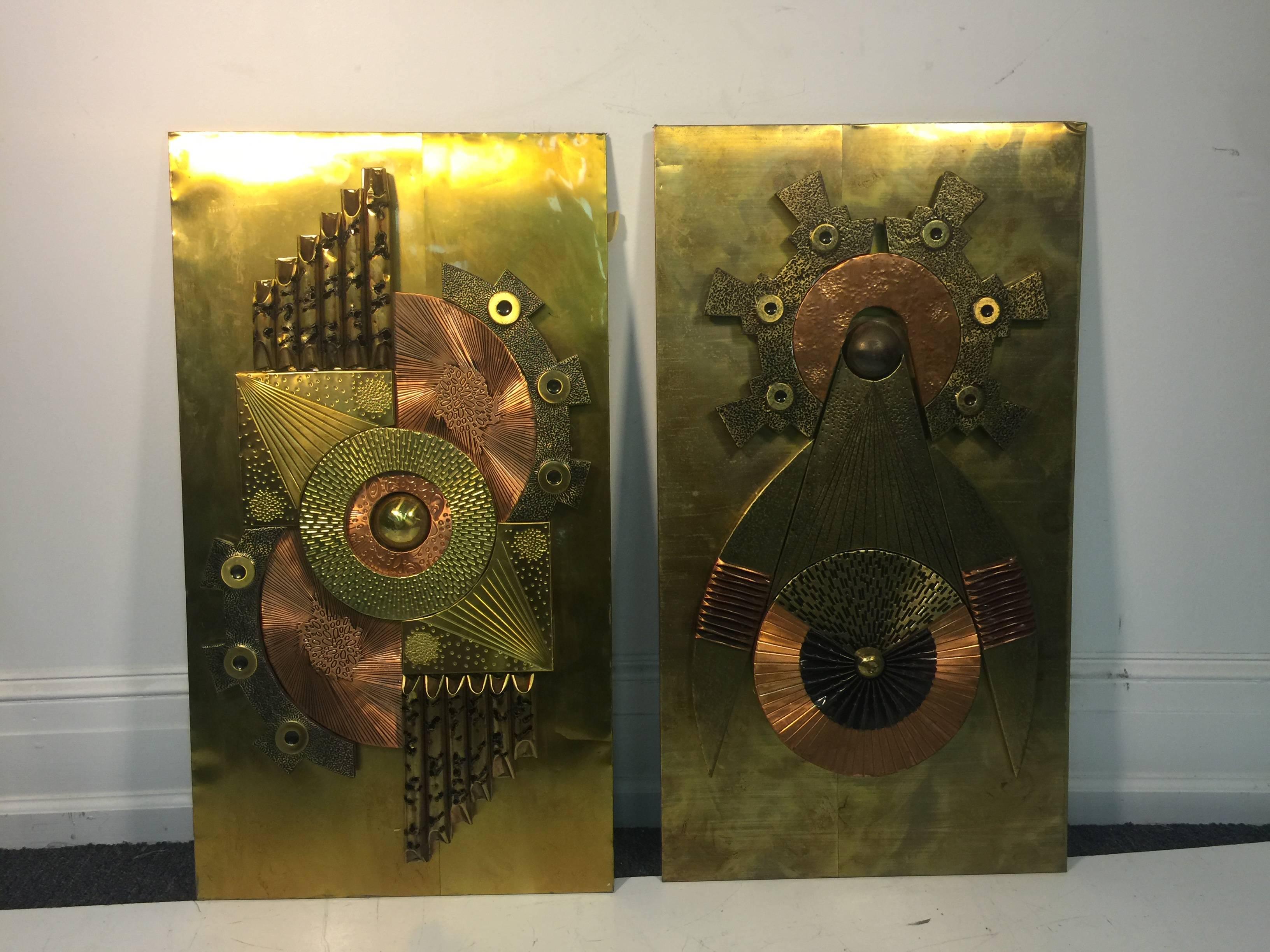 A phenomenal pair of Brutalist mixed-metal relief plaques or wall-mounted sculptures with great texture and patina in the manner of Paul Vanders, circa 1970.