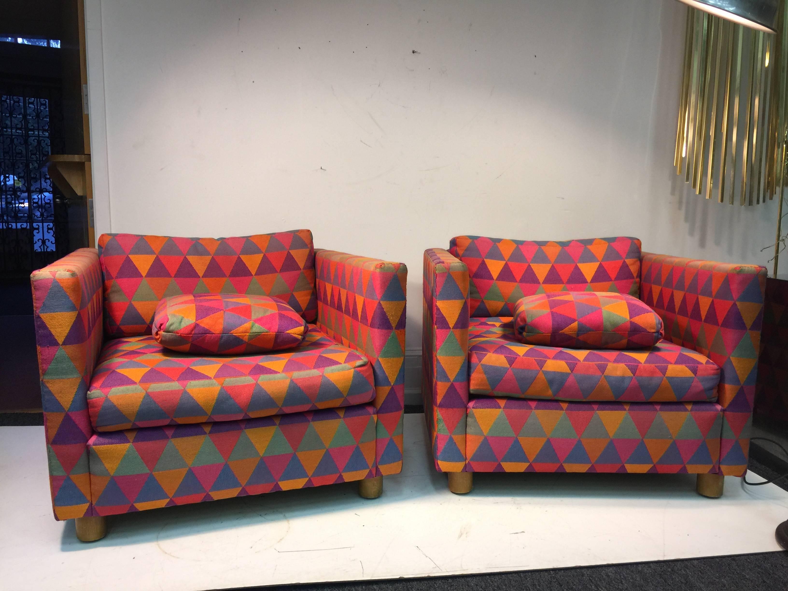 A fabulous pair of 1970s club chairs attributed to Harvey Probber in colorful, vintage, geometric patterned Larsen fabric.