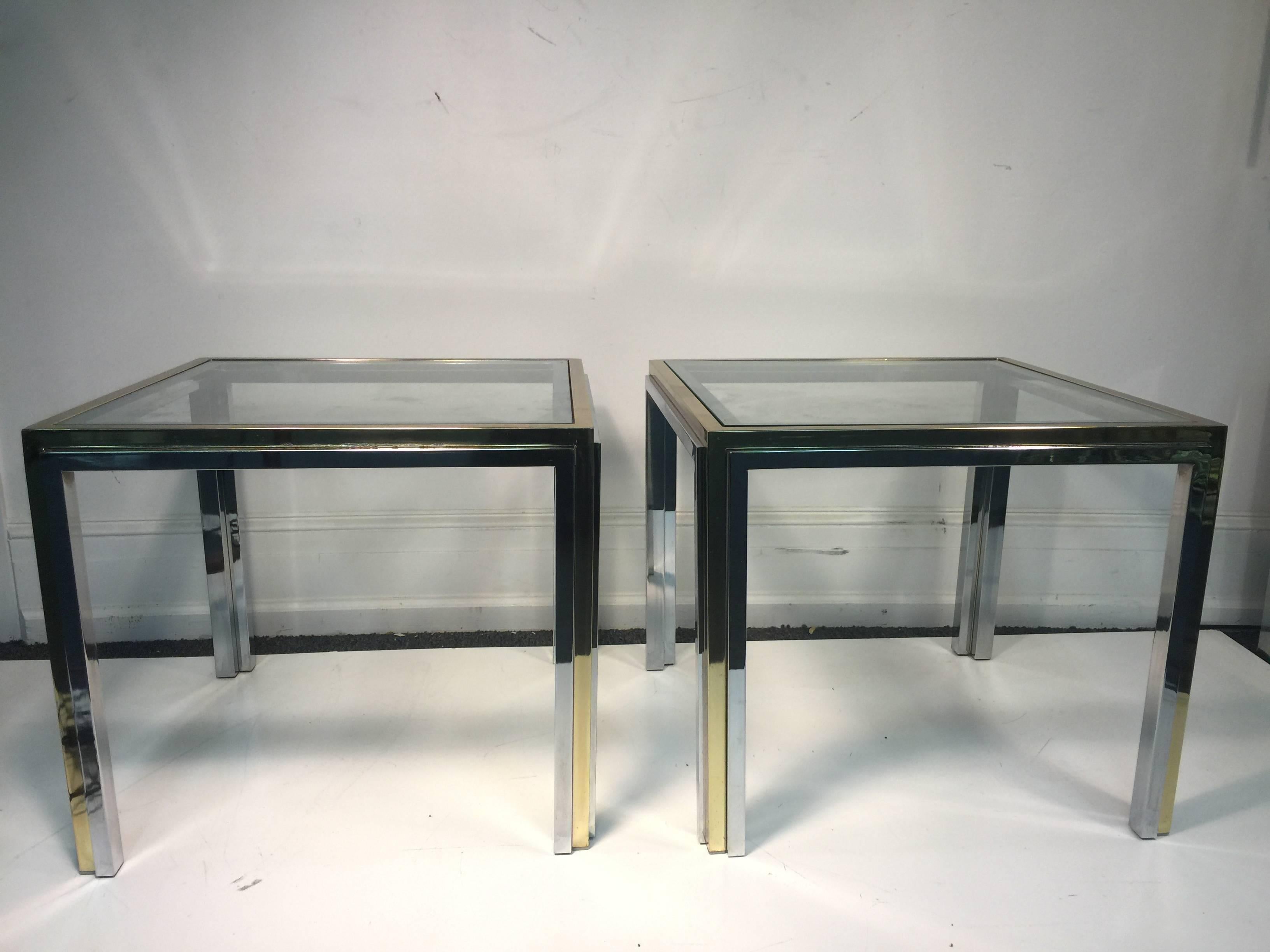 An exceptional pair of end or side tables in chrome and brass  city scape style 
 
