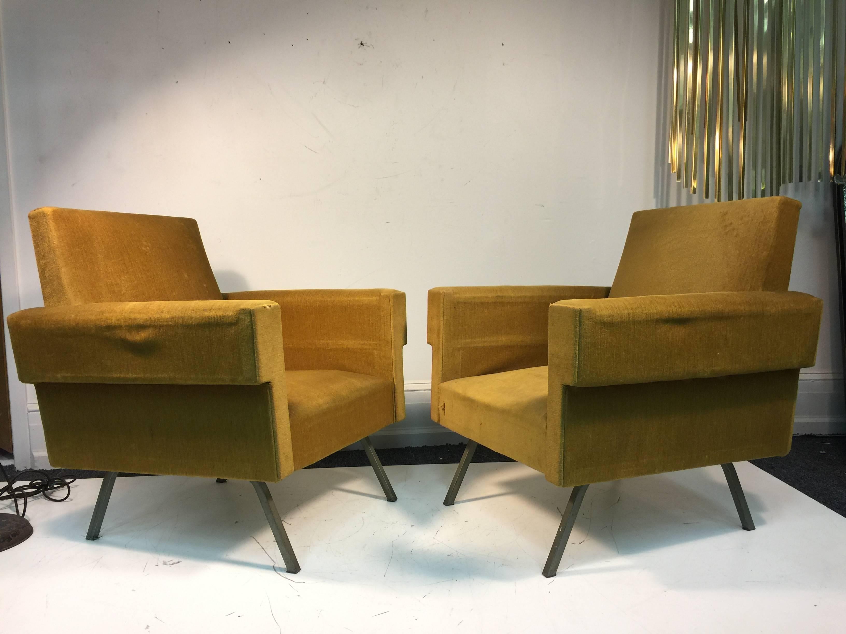 A fabulous pair of lounge chairs with distinct thick arms, and original golden color upholstery in the manner of Italian designer Marco Zanuso, circa 1970. 

Some wear and tear. Recommended re-upholstery.