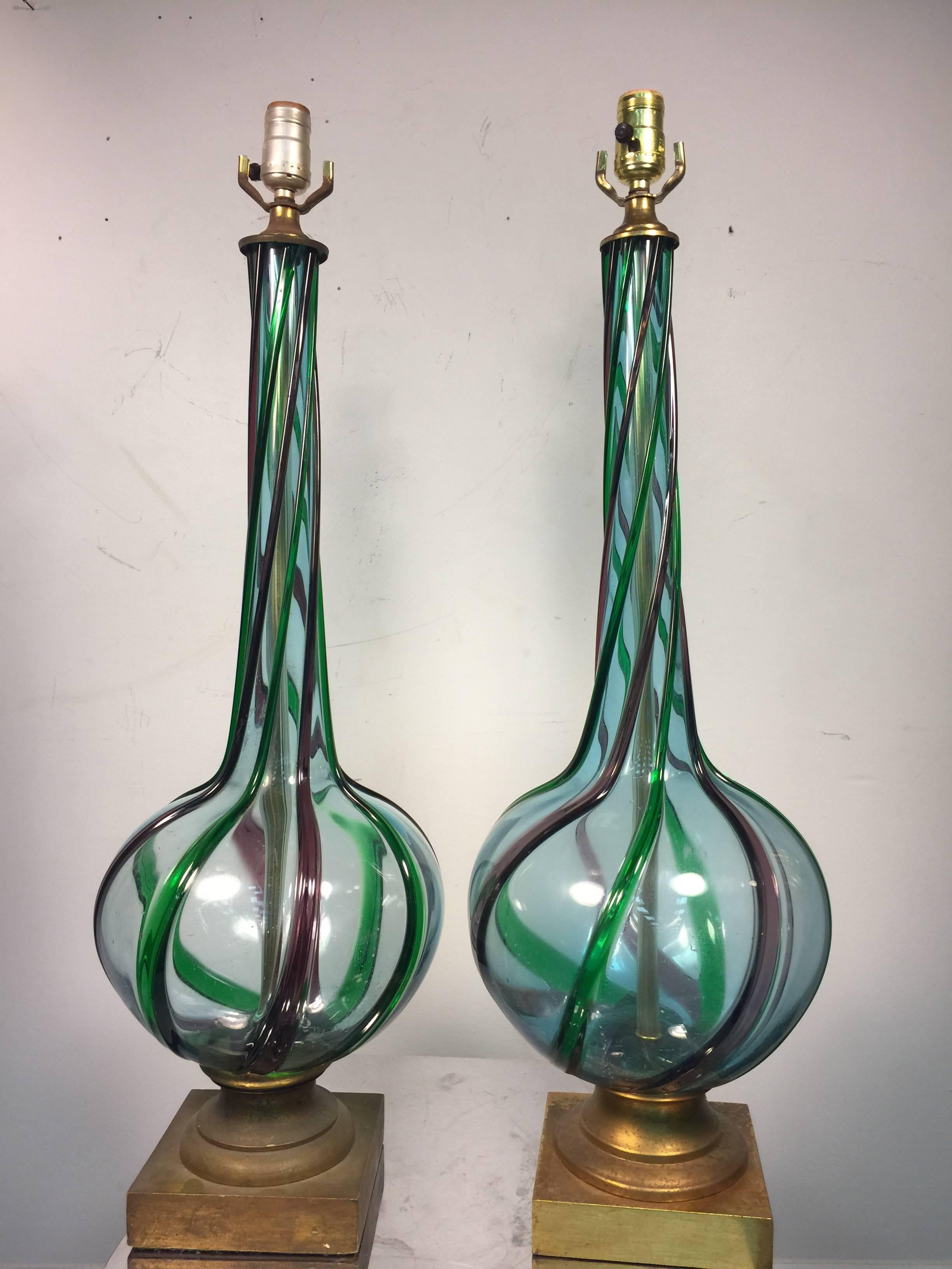 A stylish pair of Midcentury ribbed Murano glass table lamps with beautiful design, circa 1960s.