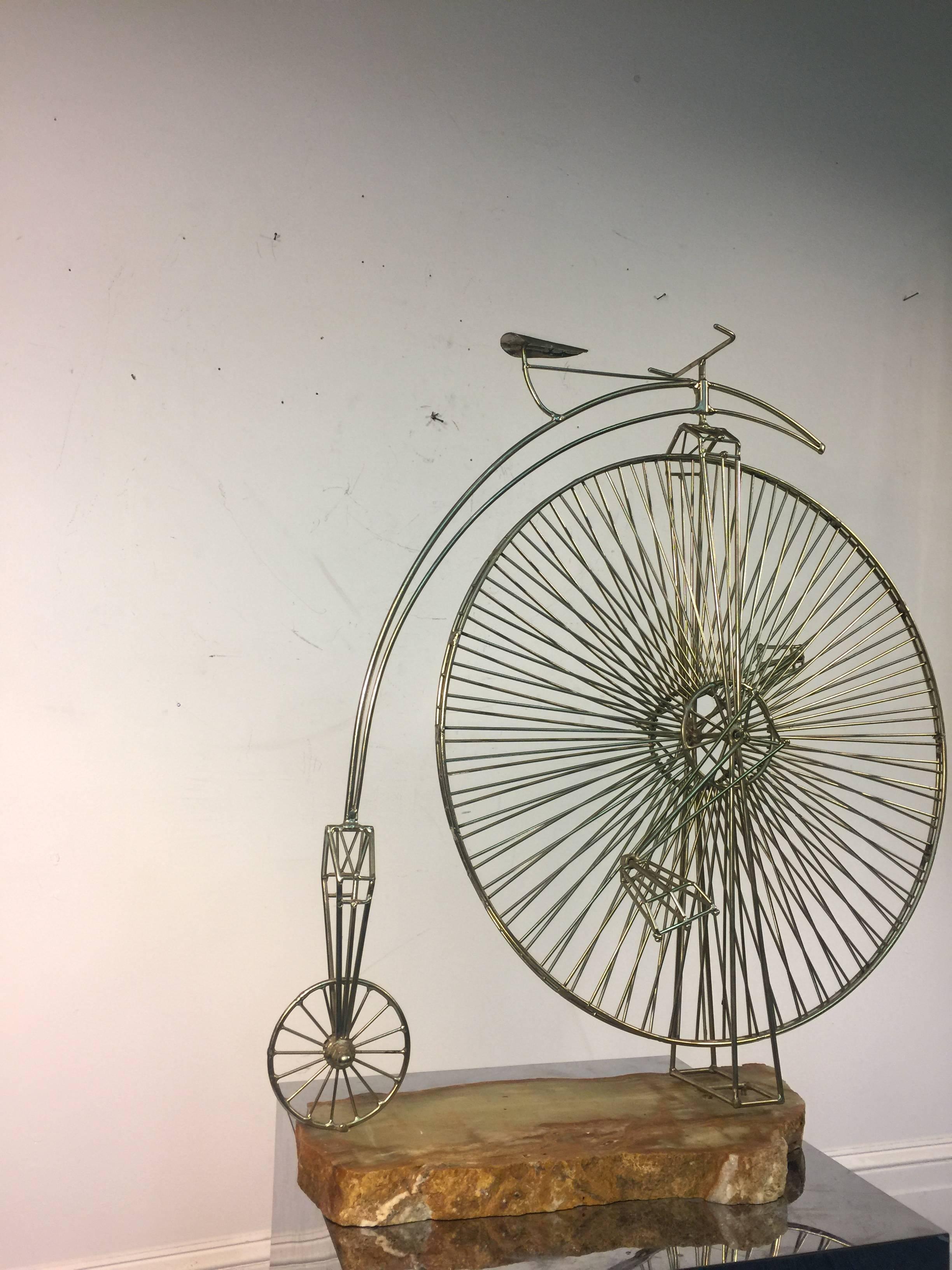 A rare, high wheel Curtis Jere metal bicycle sculpture mounted on an onyx base, circa 1970. Good vintage condition.