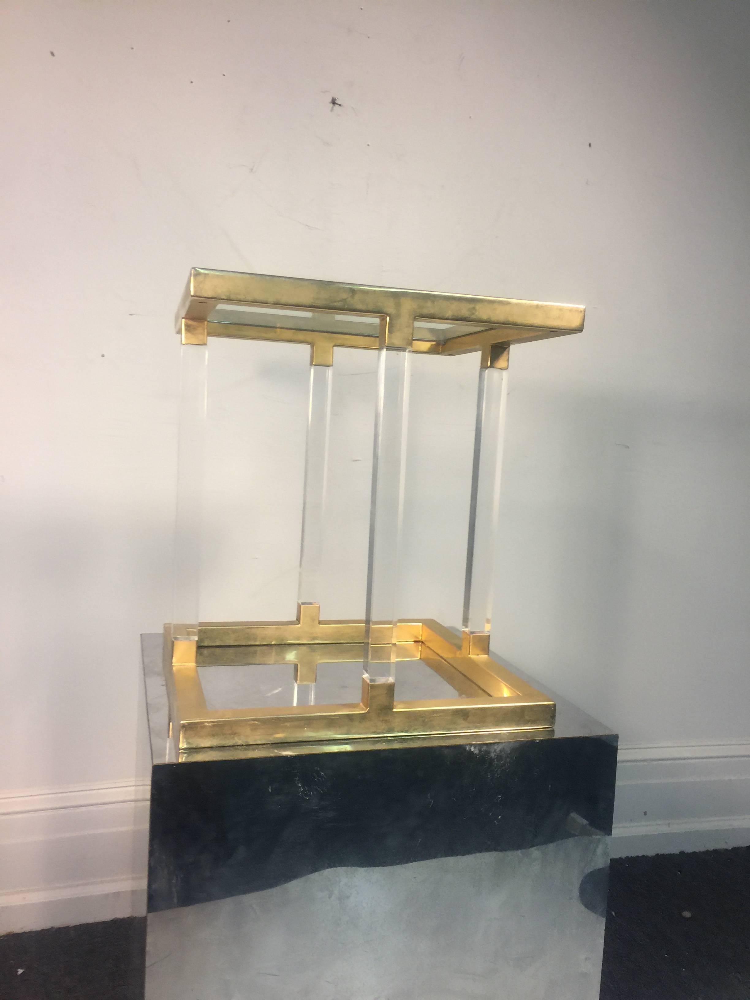 An amazing Lucite and brass accent, or side table by Charles Hollis Jones, circa 1970. Great vintage condition.