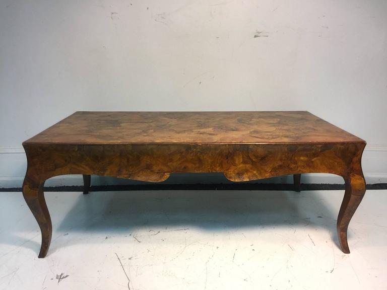An exceptional burl wood coffee or cocktail table with cabriole legs in the manner of Milo Baughman, circa 1970. Good vintage condition with age appropriate wear.