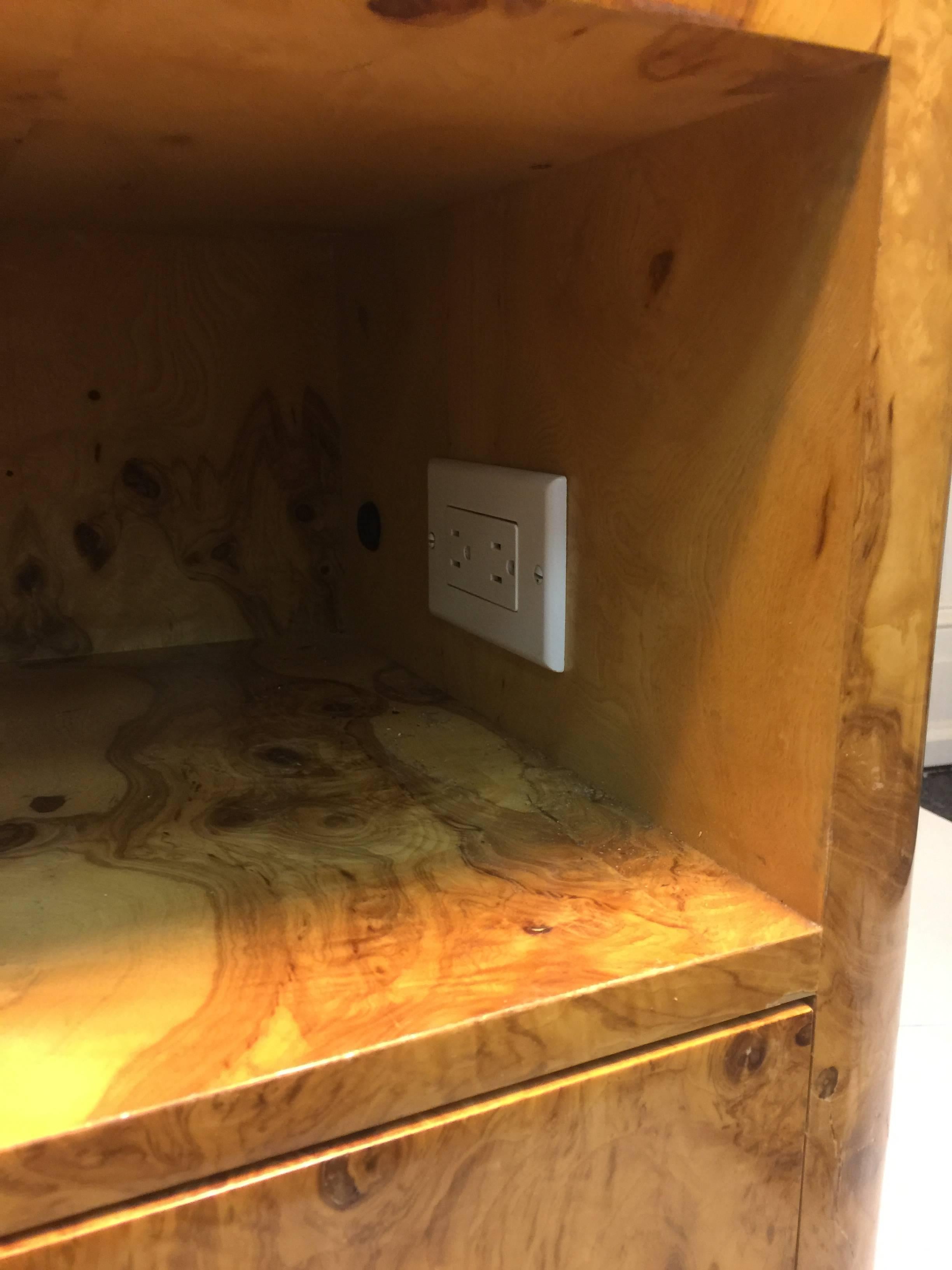 A fabulous burl wood coffee table, or center table by Milo Baughman with great storage space, circa 1970. Good vintage condition with age appropriate wear.