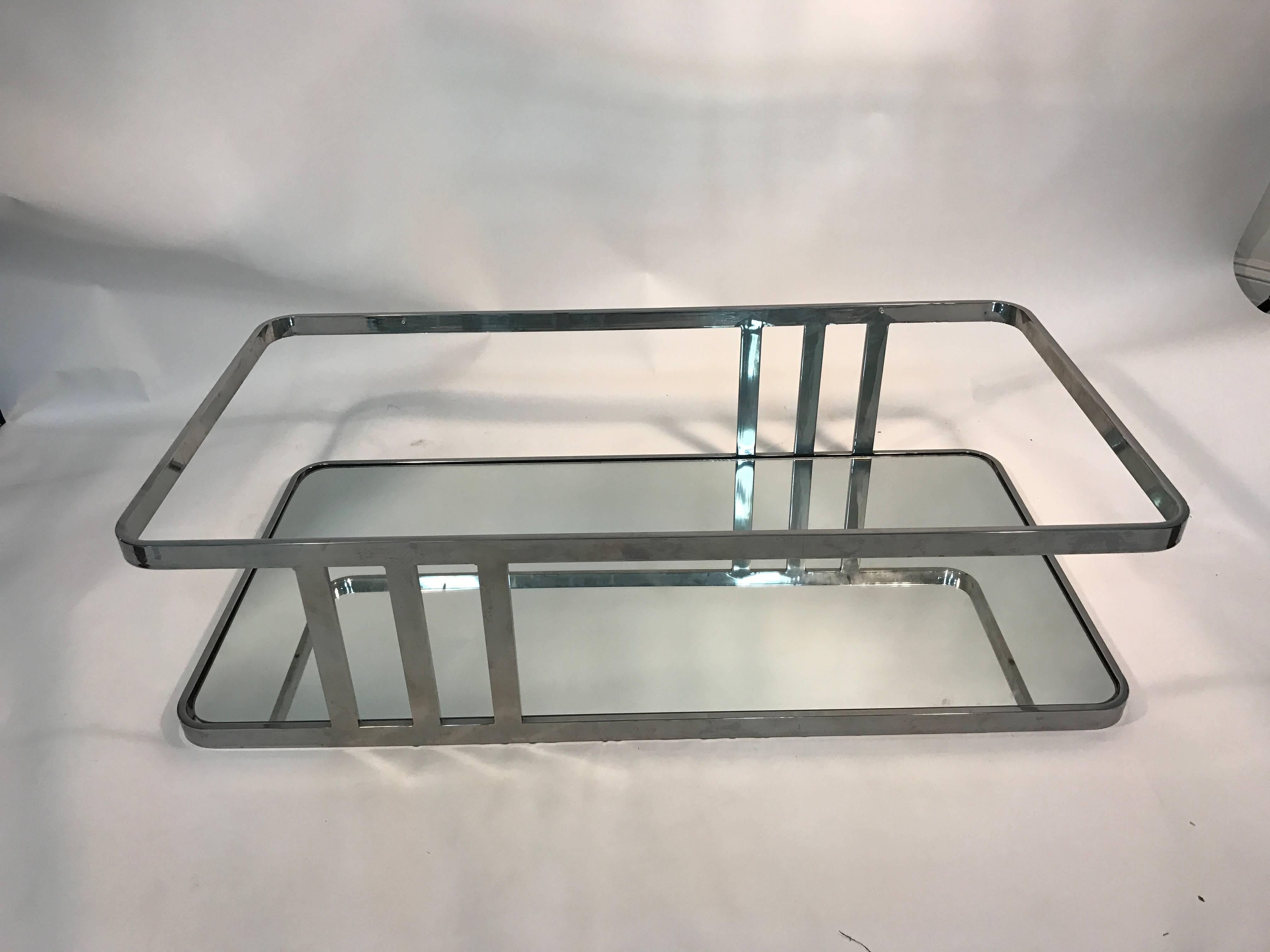 A fantastic flat bar chrome table with glass top and base in the style of Milo Baughman. Unusual design, circa 1970. Great vintage condition.