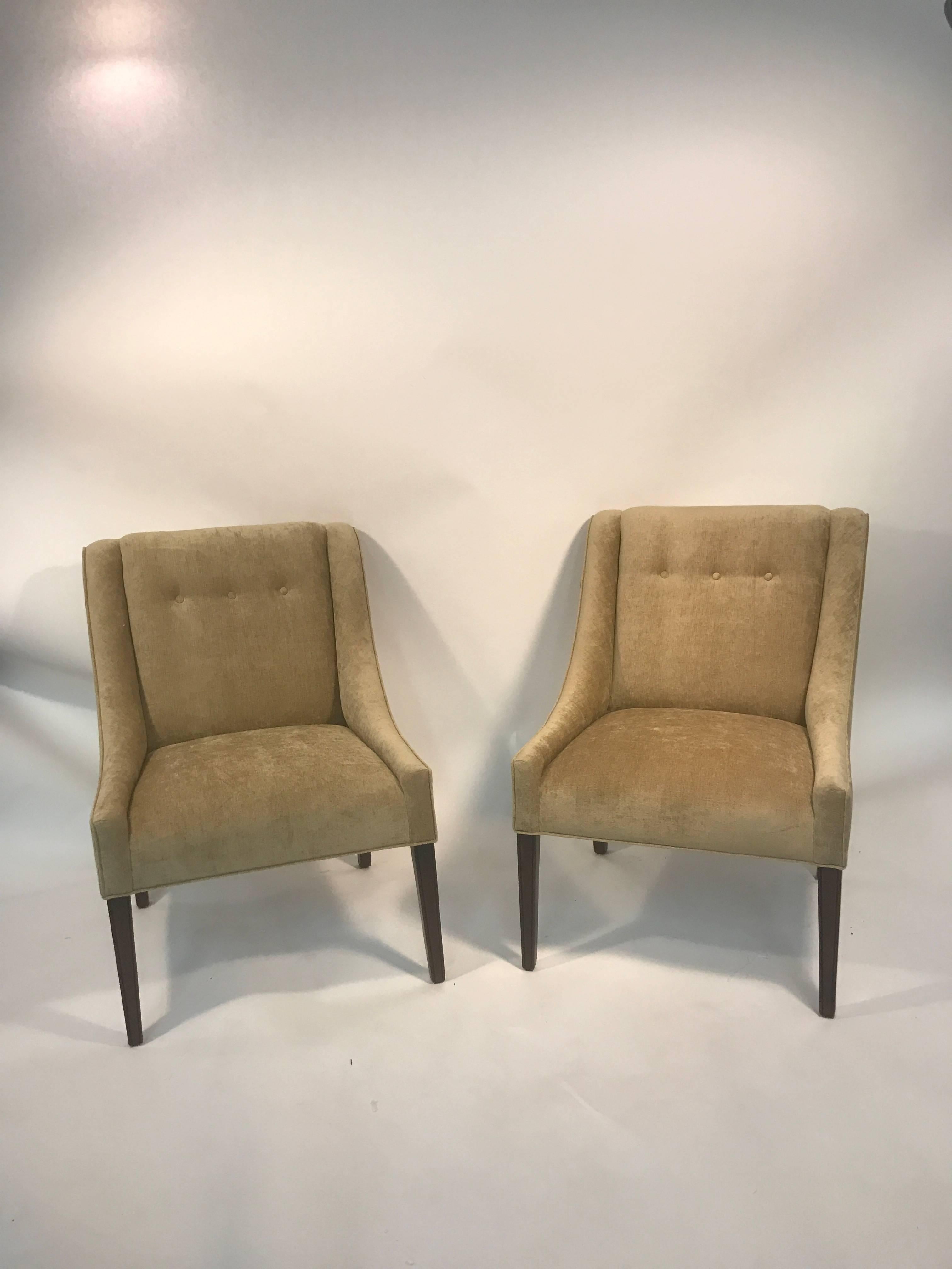 An elegant pair of button tufted slipper chairs with beautiful upholstery in the manner of Edward Wormley, circa 1970. Good condition.
 