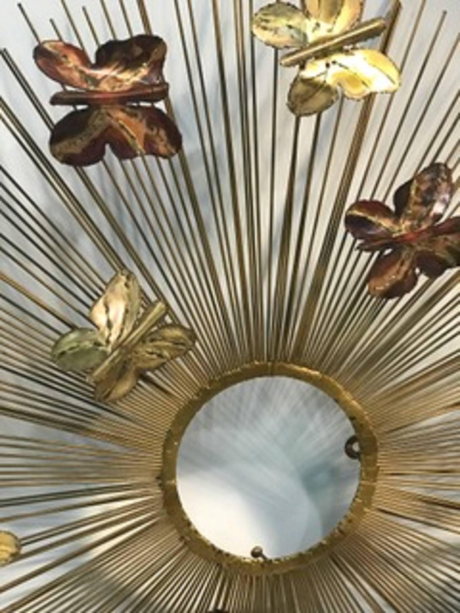 A beautiful and rare Curtis Jere sunburst wall sculpture with mixed-metal butterflies. Signed Jere, circa 1970.