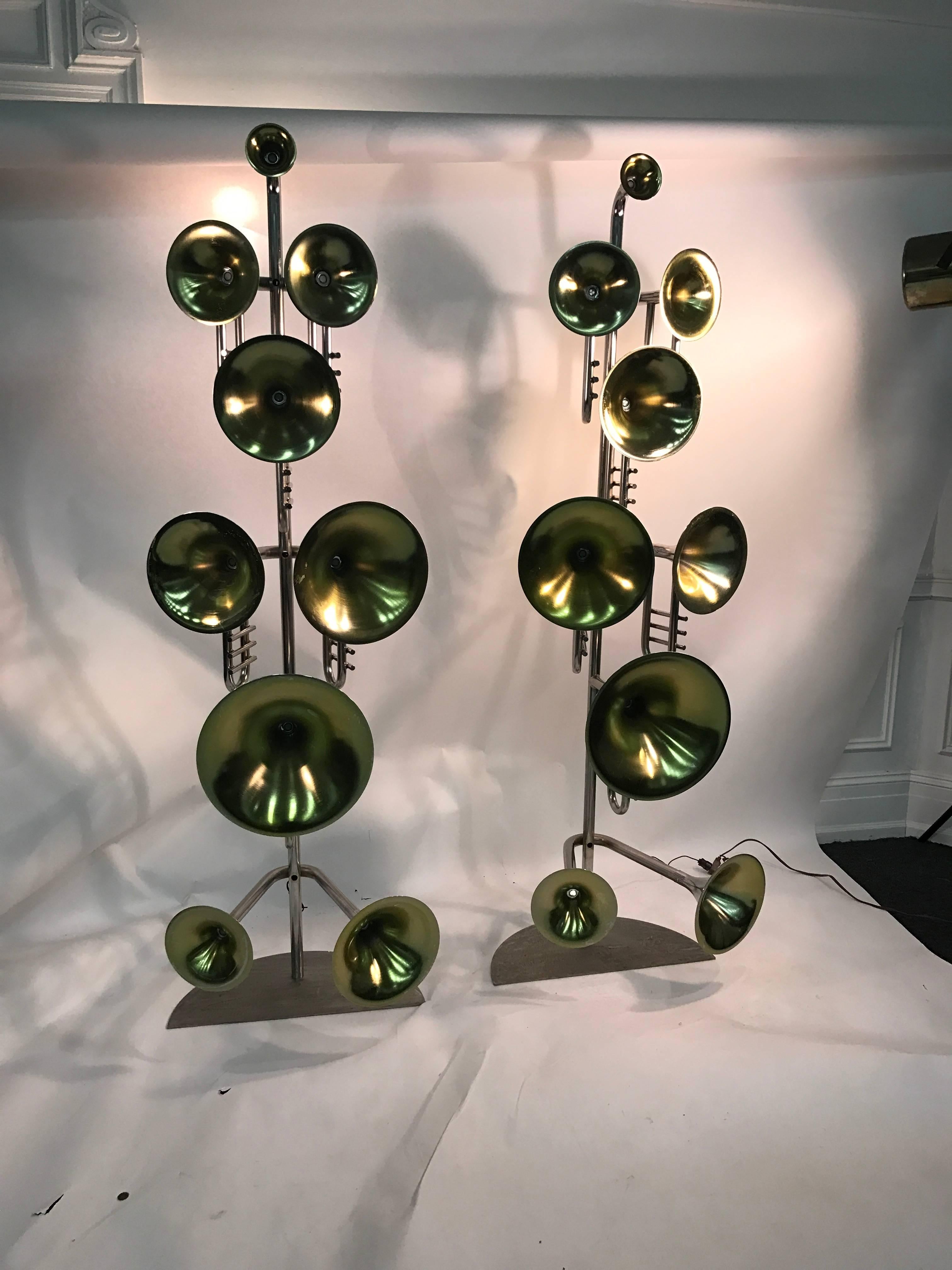 An exceptional pair of Italian trumpet form, floor lamps in chrome-plated metal with brass finish interior in the manner of Stilnovo, circa 1980. Each lamp has nine lights. Good vintage condition with age appropriate patina.