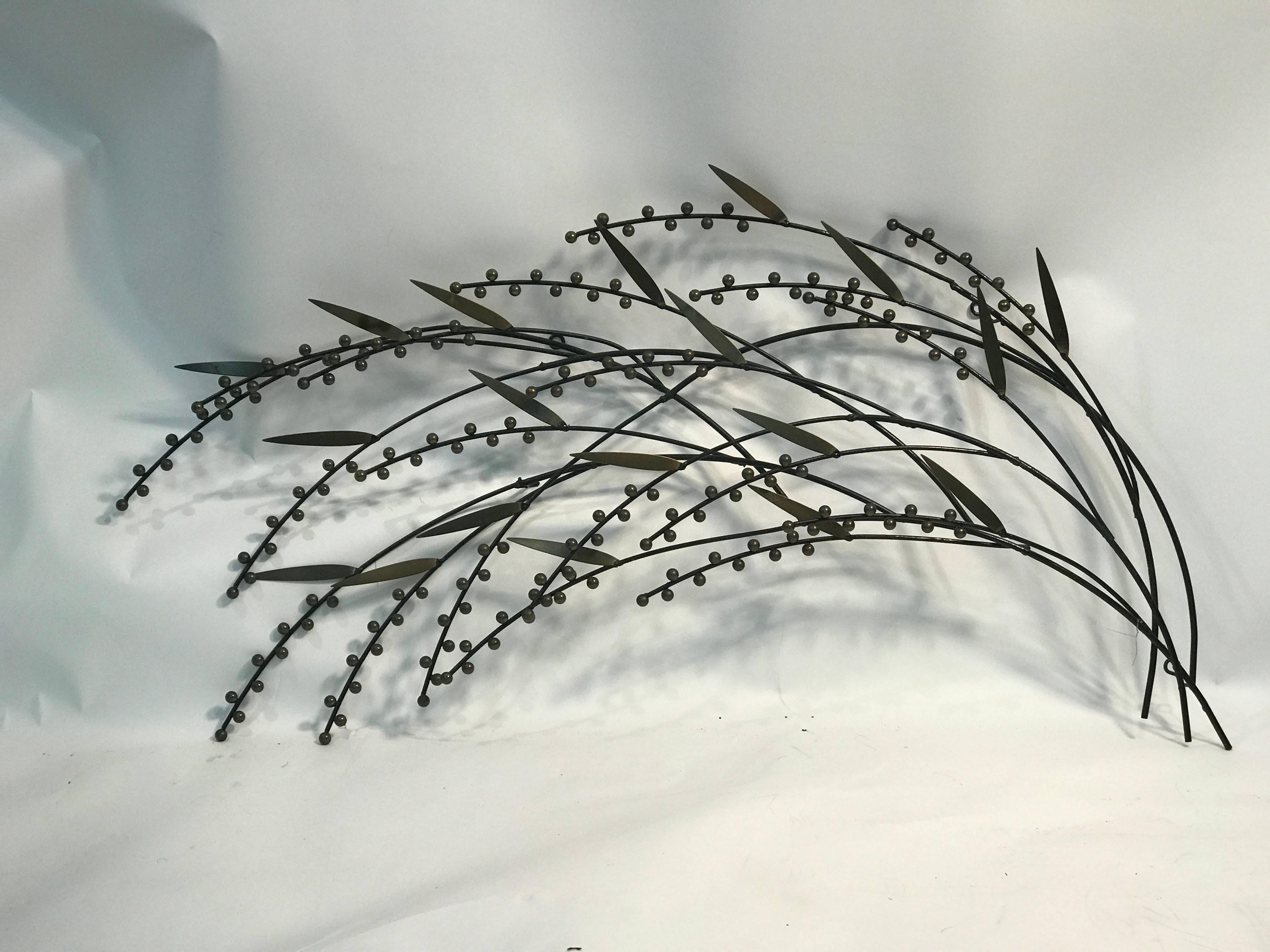 A beautiful berry and tree branch wall sculpture by Curtis Jere. Signed and dated 1987.