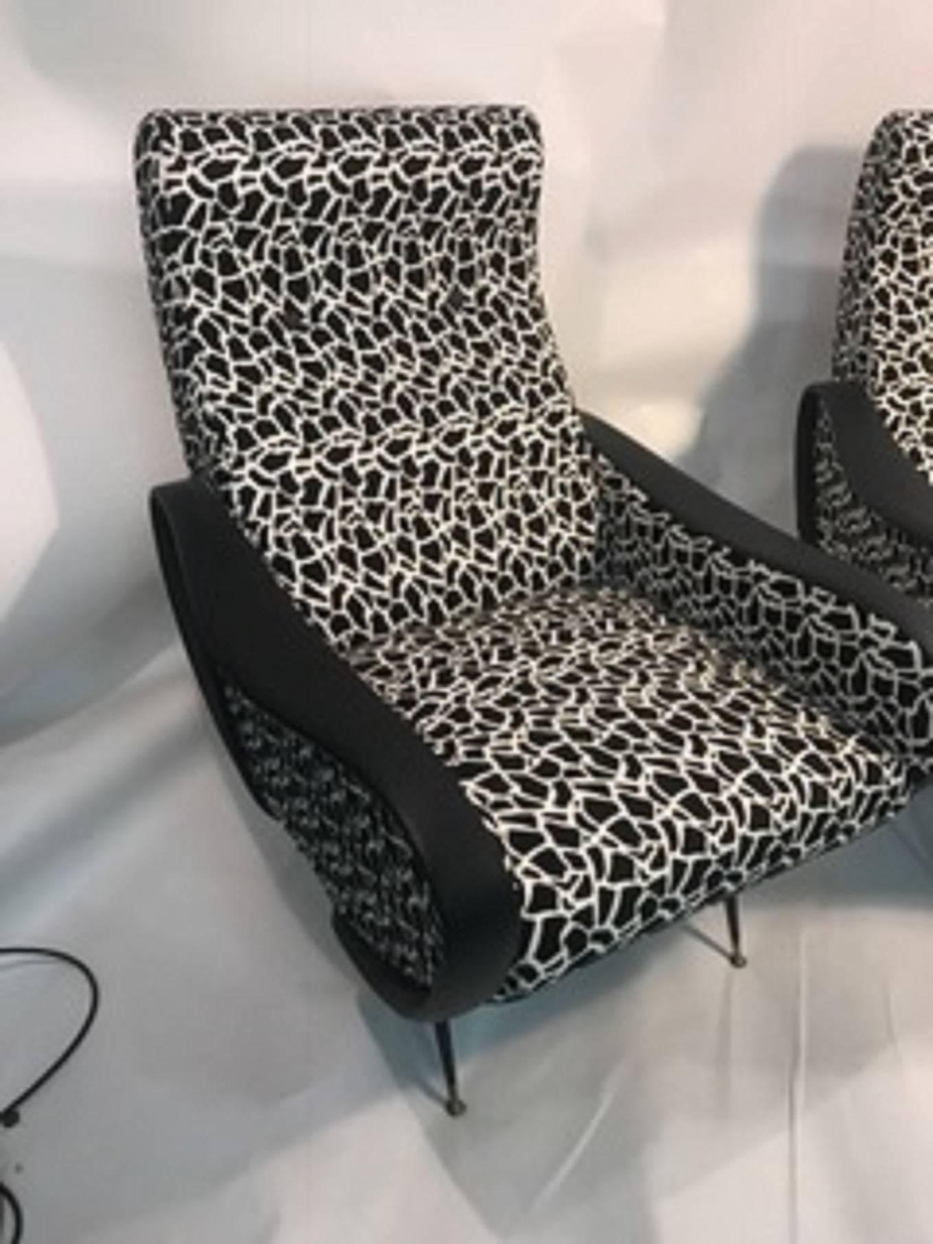 A magnificent pair of stylish, Italian, lounge chairs upholstered in a fantastic black and white fabric in the manner of Marco Zanuso, 21st century. Great condition.