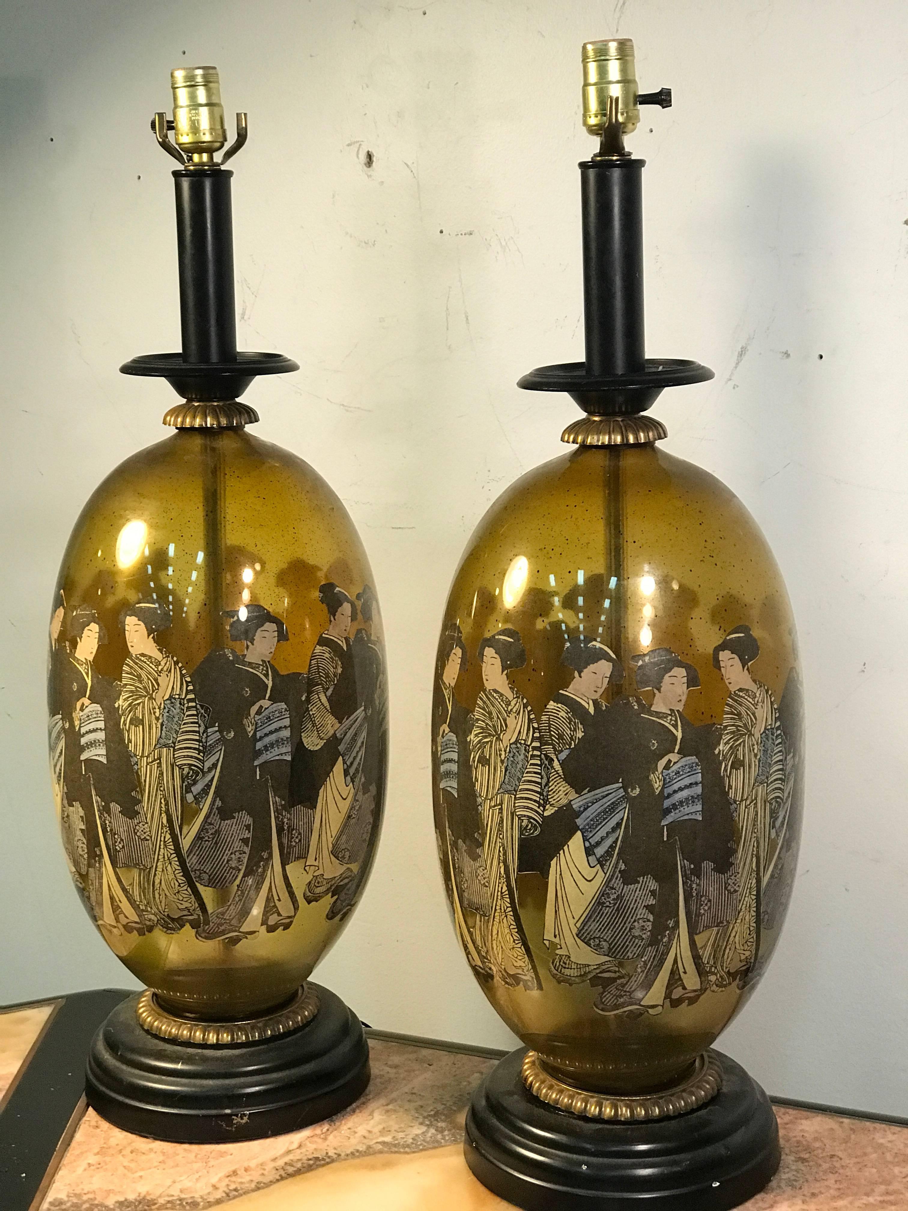 A beautiful pair of Asian inspired hand-painted table lamps in the manner of James Mont, circa 1970. Good vintage condition with some wear appropriate with age.