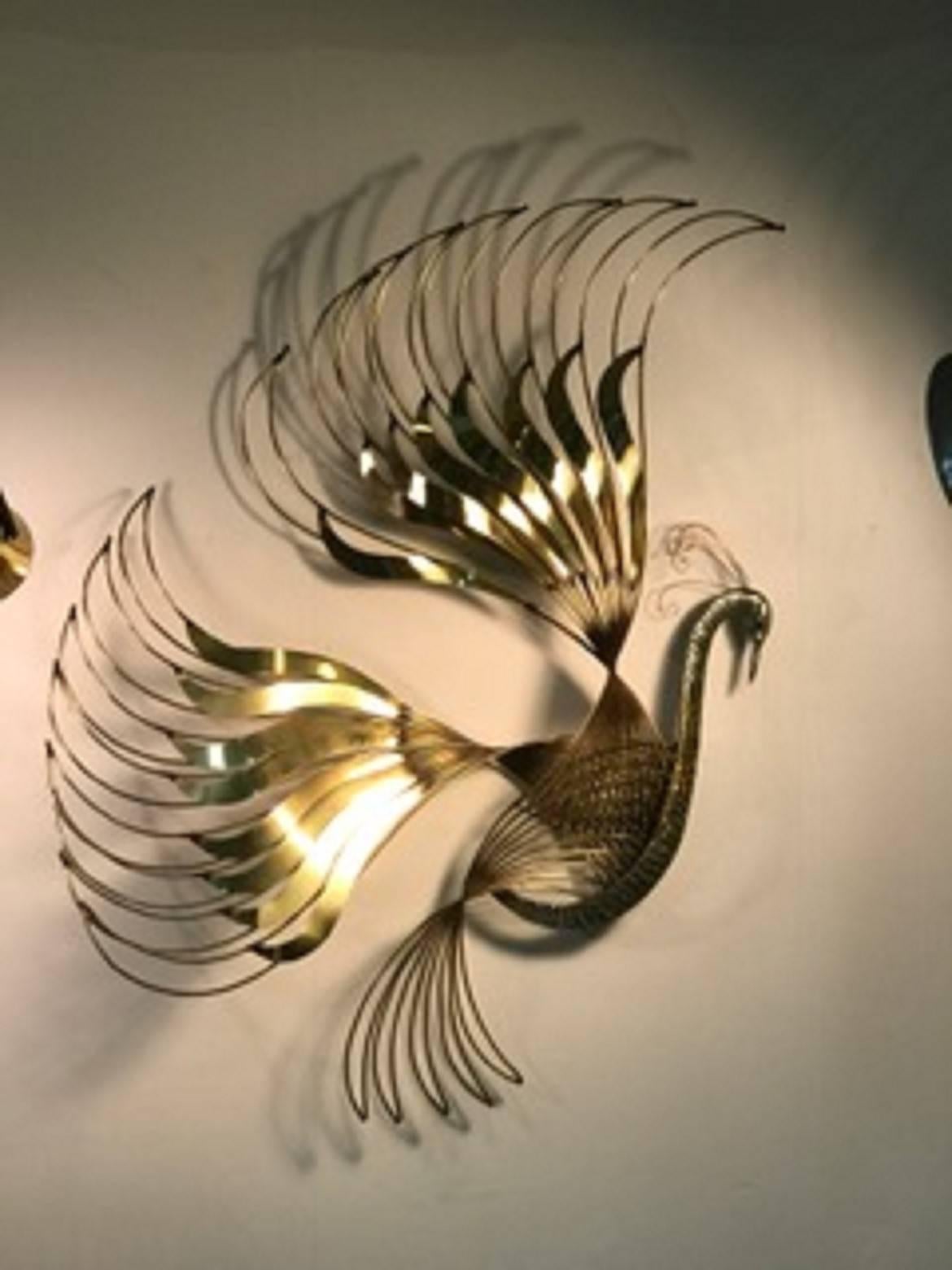 A pretty peacock wall-mounted sculpture with beautiful brass feathers and exceptional detail by Curtis Jere, circa 1970. Great vintage condition.