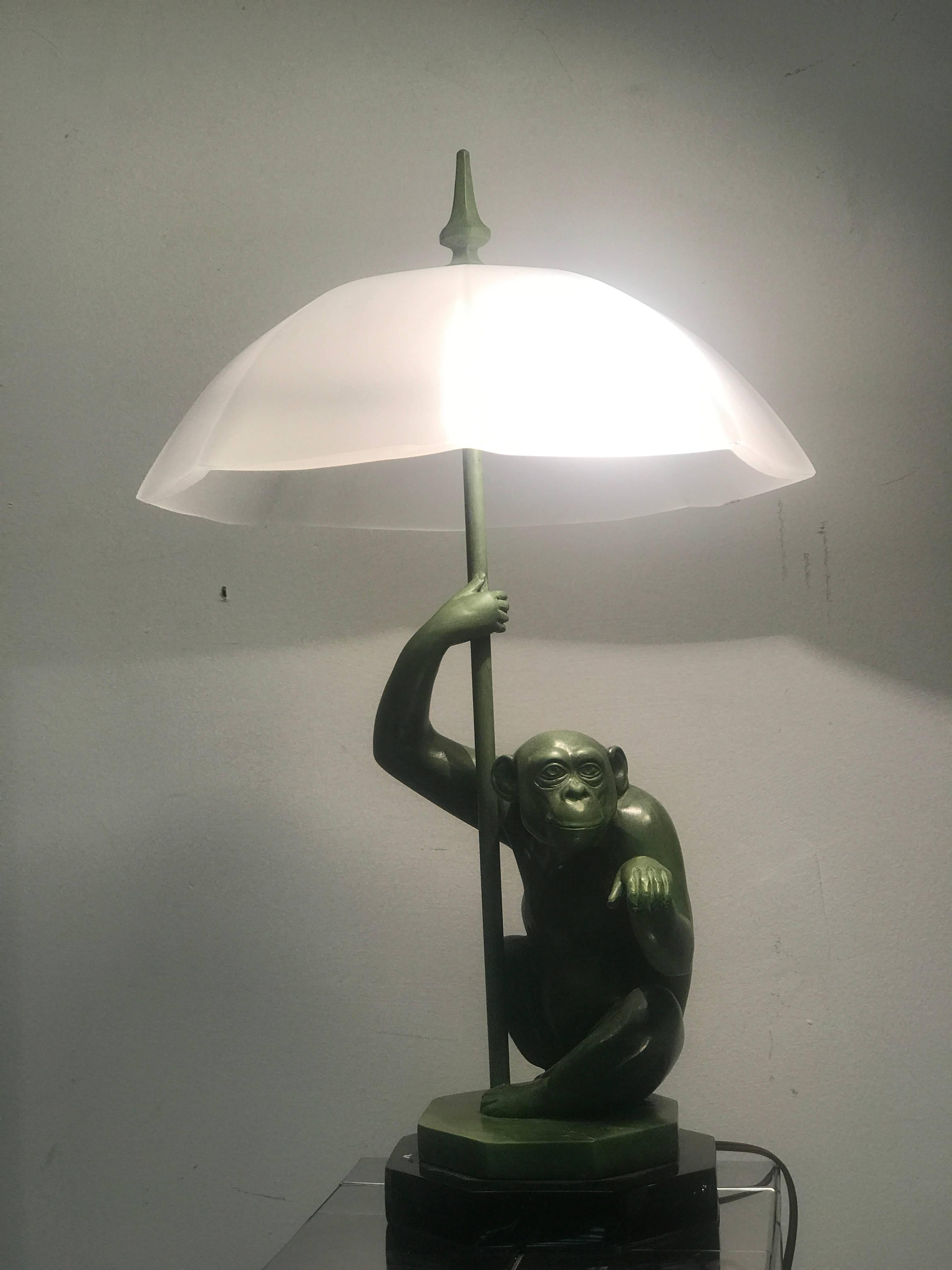 A magnificent and rare sculptural monkey table lamp attributed to Max Le Verrier cast out of patinated metal, circa 1960. Very good vintage condition.
