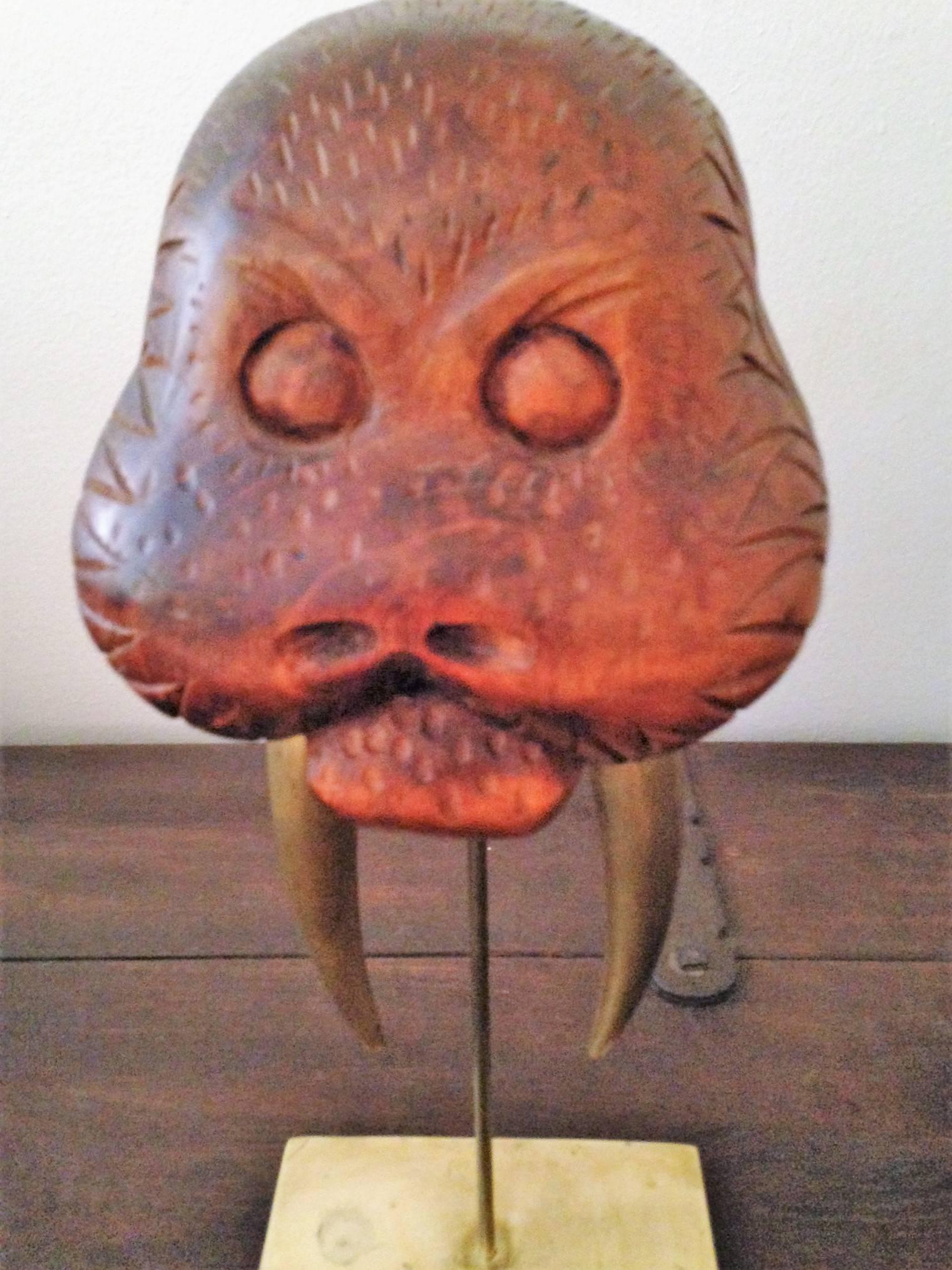 Adorable and well executed sculpture of a walrus head with beautiful brass Tusks mounted on a brass plinth signed Sarreid Limited dated 1970s.Great accent piece for a high end console.
