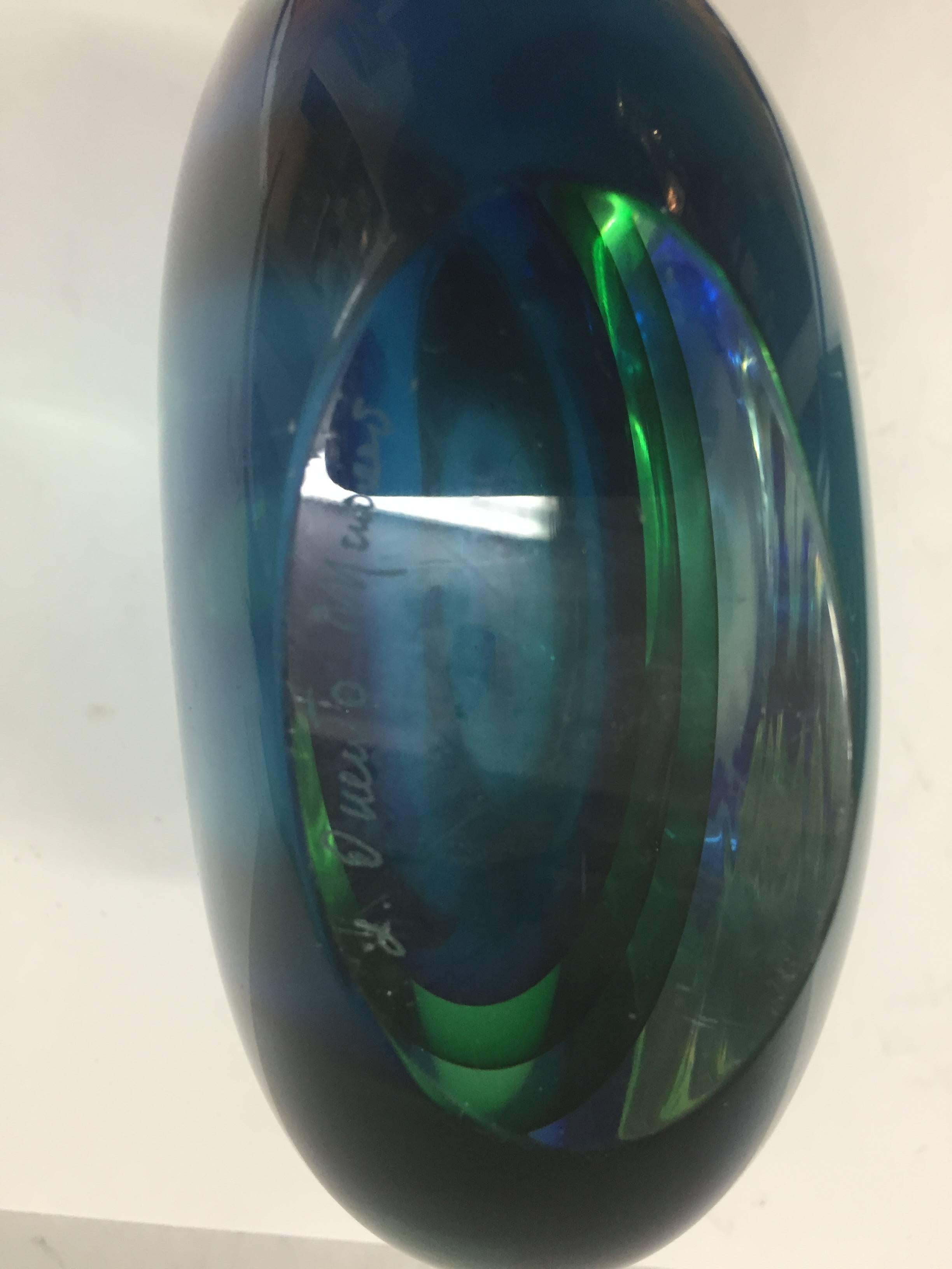 An Italian Murano glass vase circa 1950s with layers of clear, blue and green glass attributed to Flavio Poli.