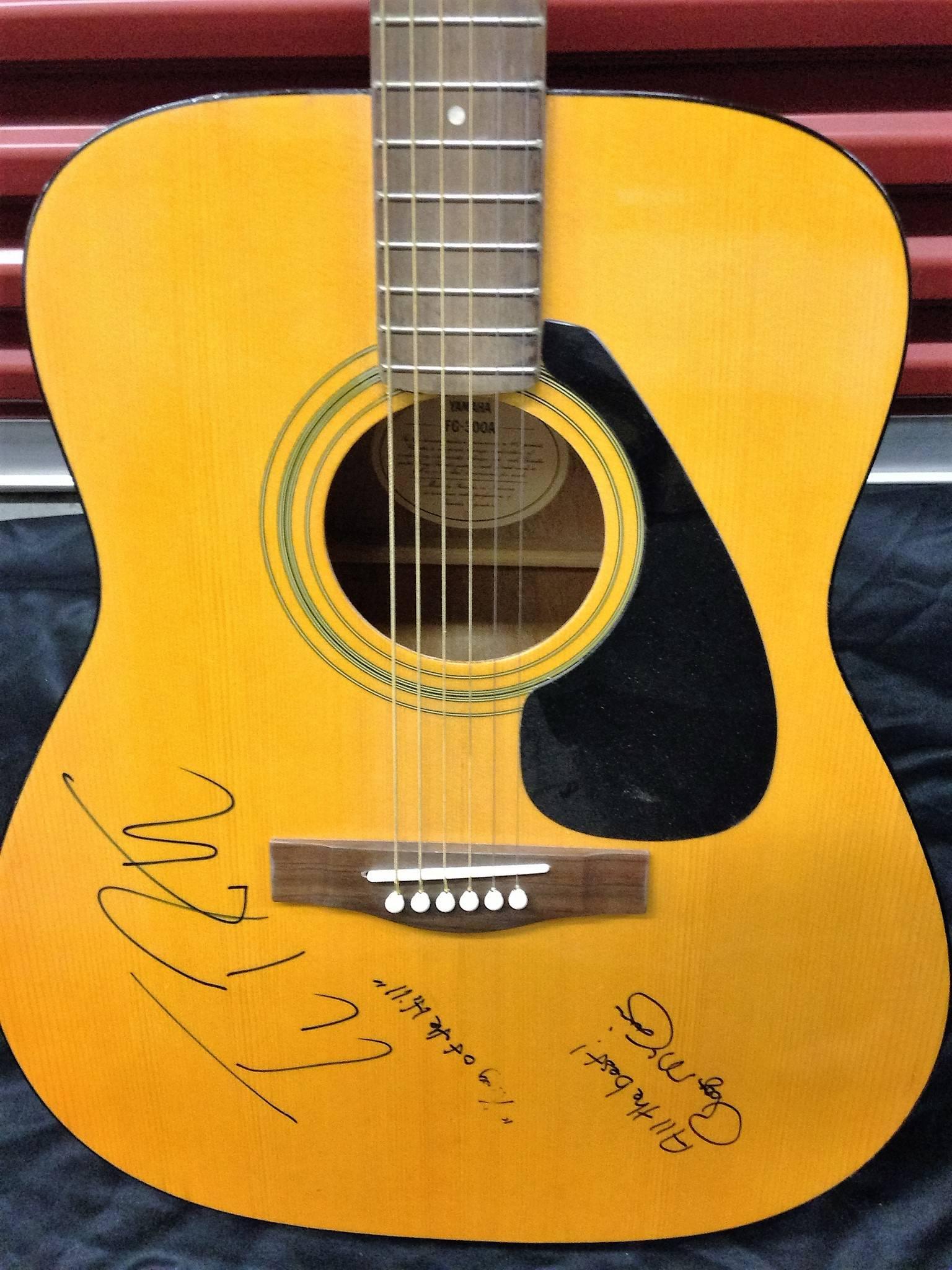 Guitar signed by Tom Petty and Roger McGuinn obtained in person during the 1990s by the seller. This guitar is a Yamaha FG 300 A, made in Indonesia.