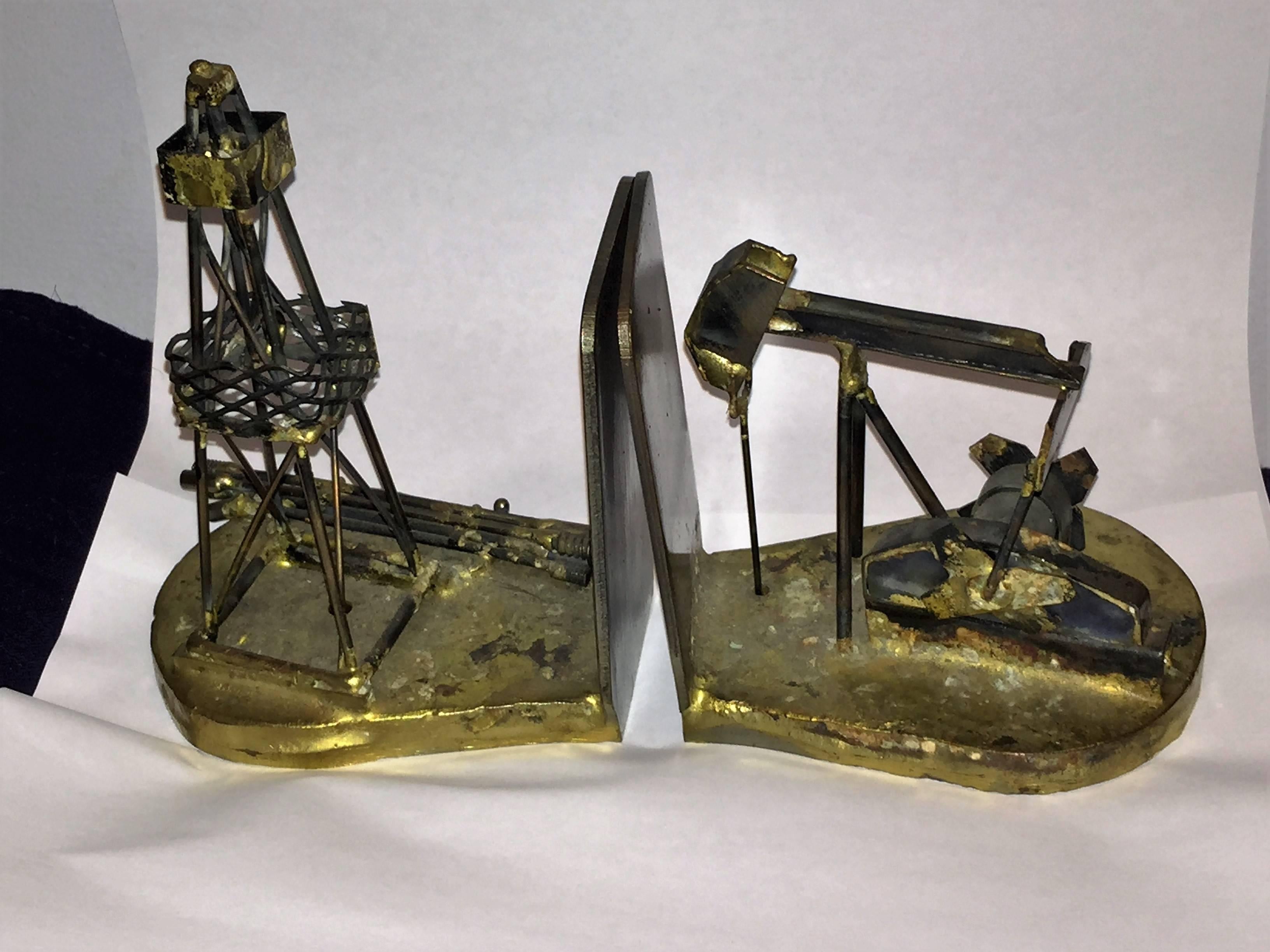 Cool pair of steel and mixed metal sculpted bookends done in the Brutalist manner. These substantial bookends are signed Ruza and dated 1980.These would be a nice accent for a high end modern desk.