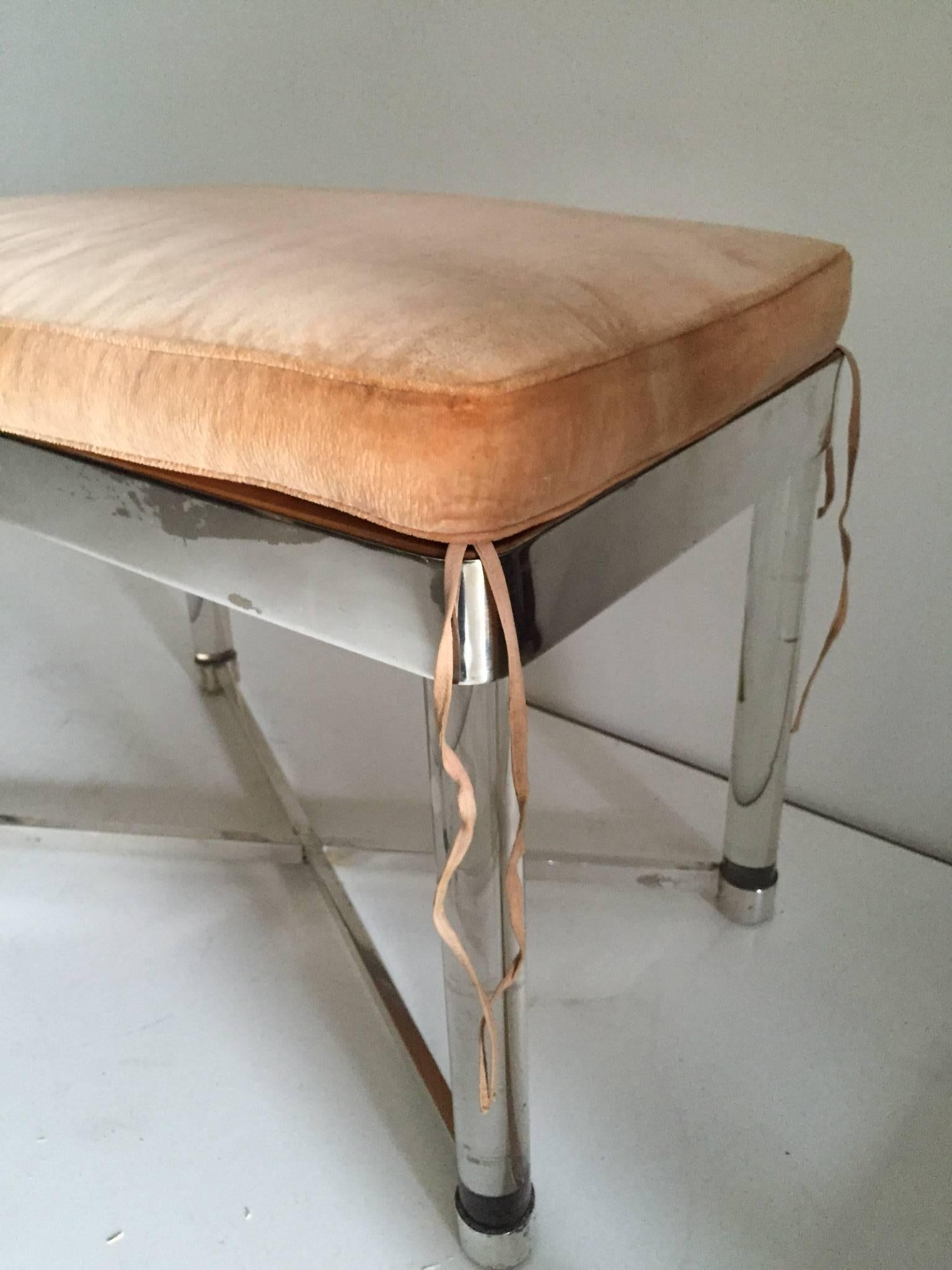 A bench or stool designed in the Manner of Karl Springer with glass legs and polished chrome X-base and Frame.