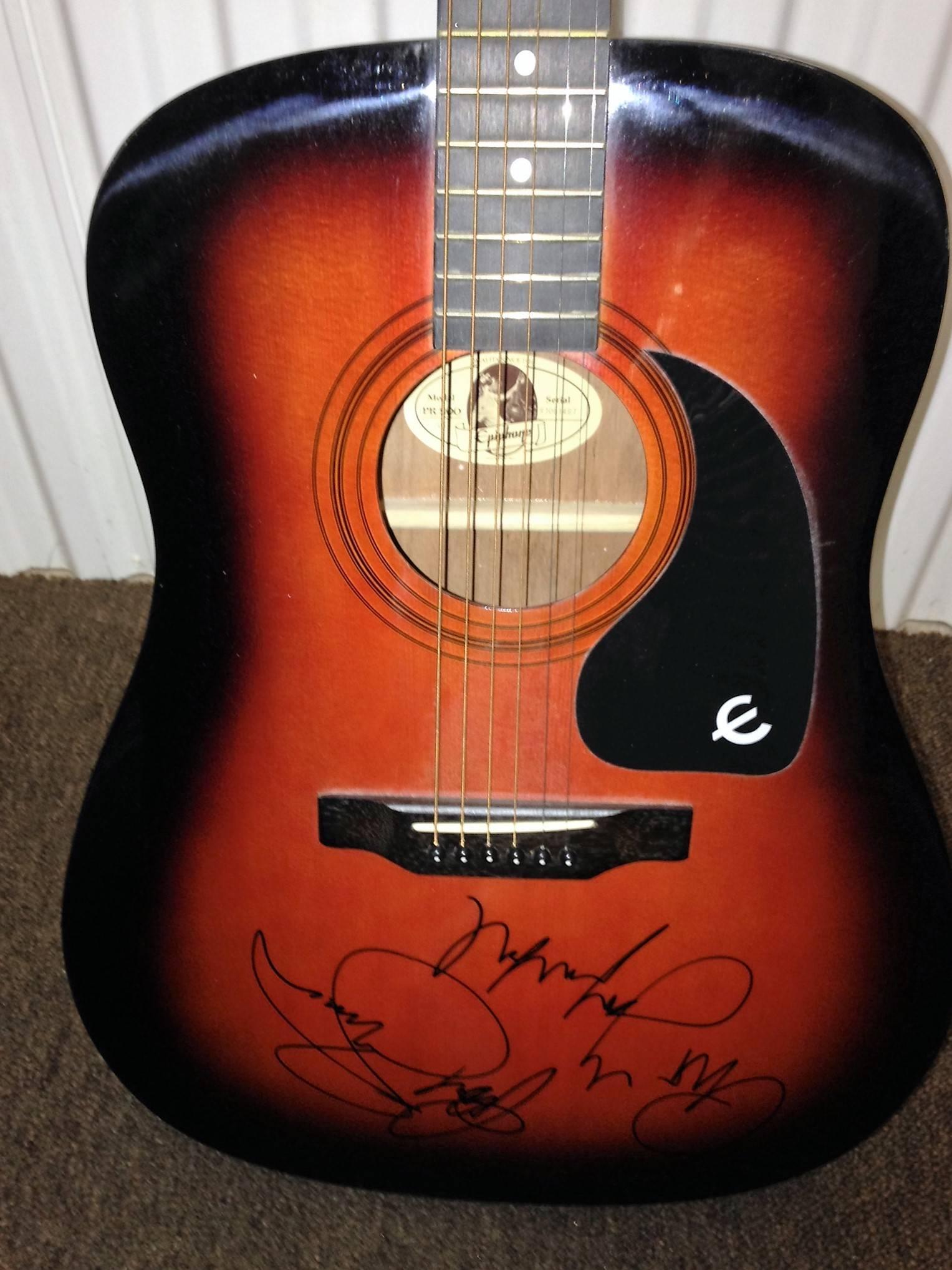 This guitar is signed by Paul Simon and Art Garfunkel in 1994, obtained in person by the seller directly from the Artists. This is a Gibson Epiphone sunburst guitar, made in Korea. This guitar and the autographs are in excellent condition.