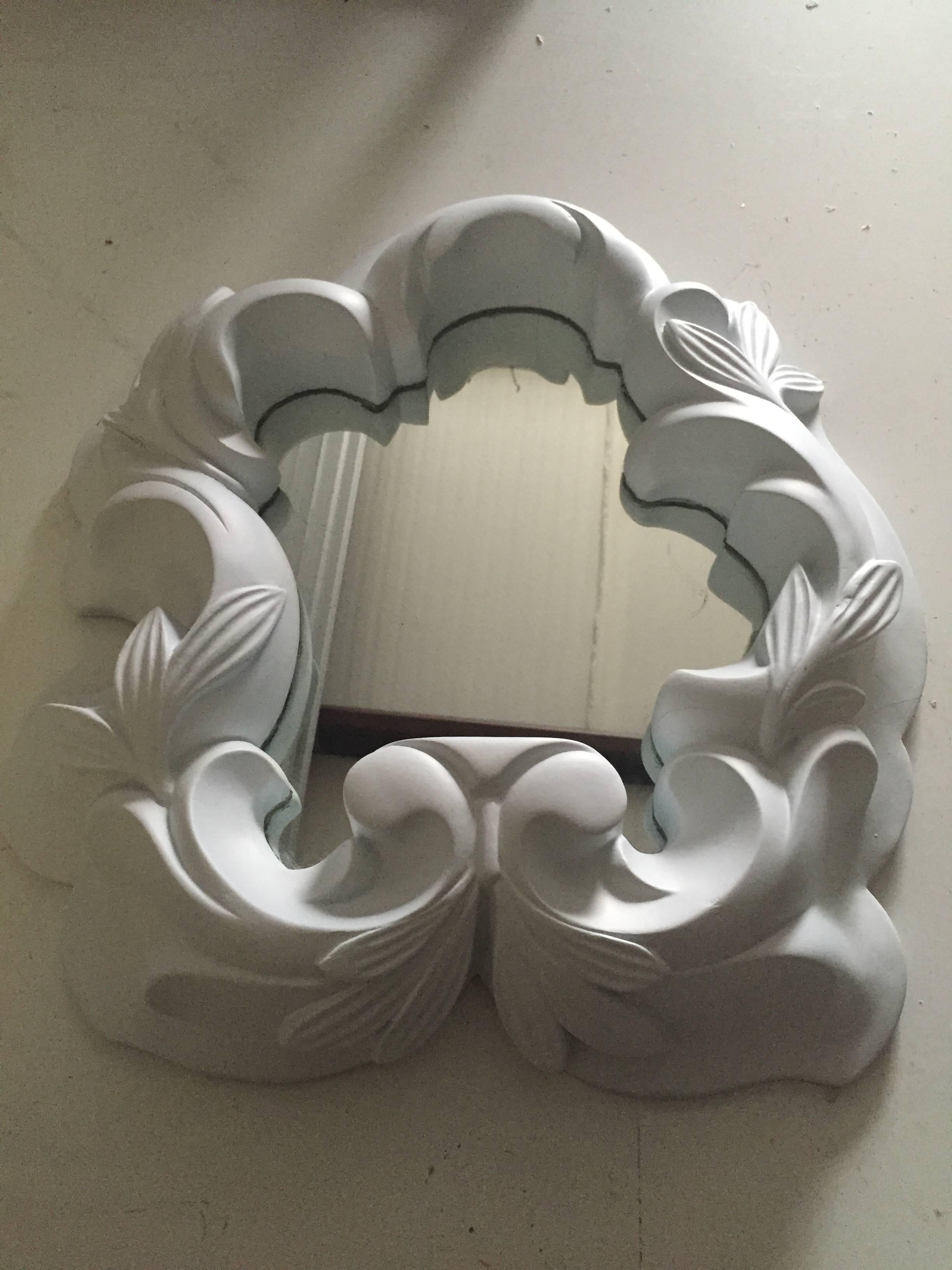 A French circa 1940s plaster wall mirror in the style of Serge Roche.