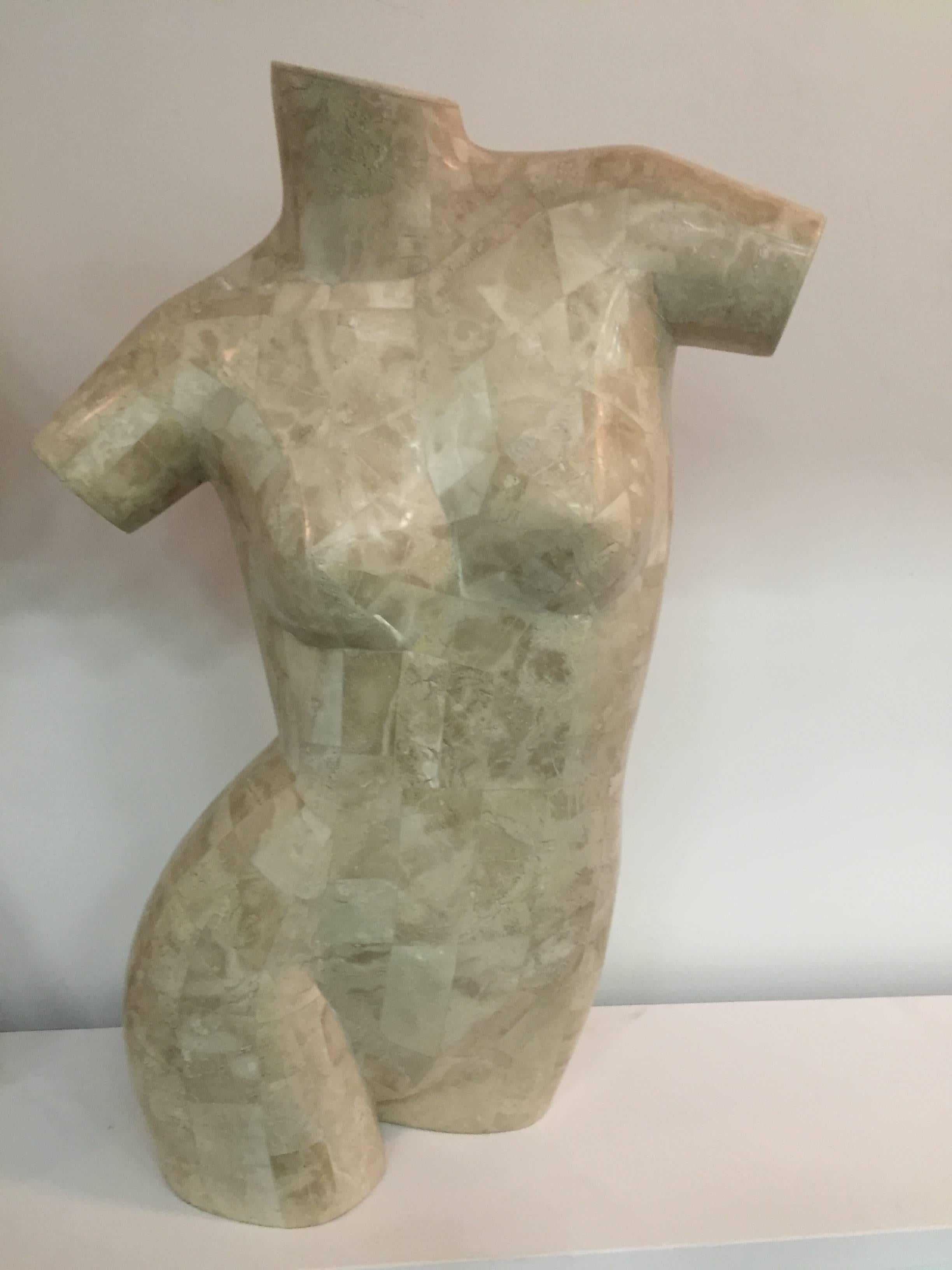 A sculptural male and female torso made of tessellated marble by Maitland-Smith. 

Female: 28 H x 18 W x 8 D.
Male: 30 H x 22 W x 12 D.