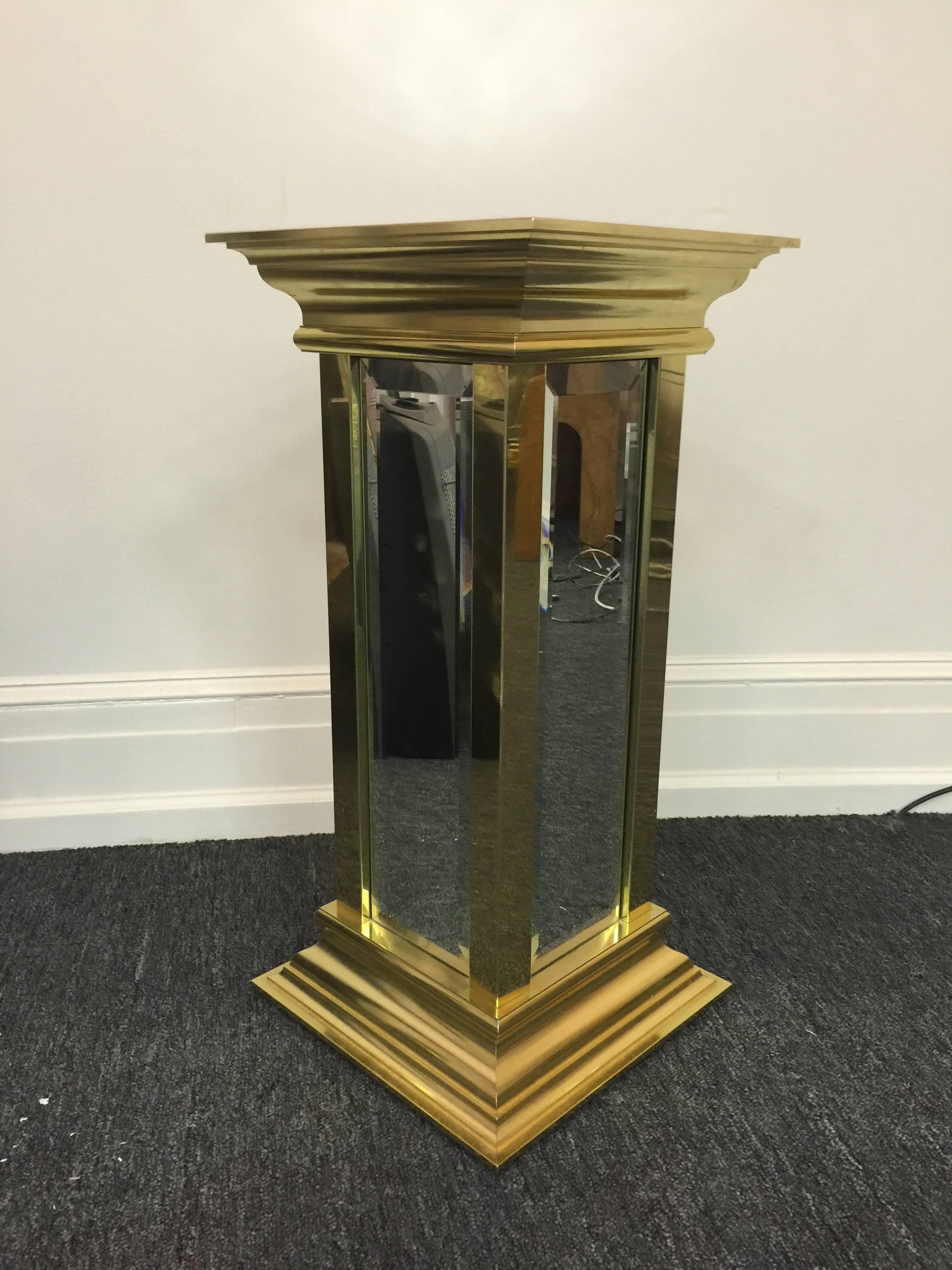 A magnificent brass and mirrored pedestal by Mastercraft, circa 1970.