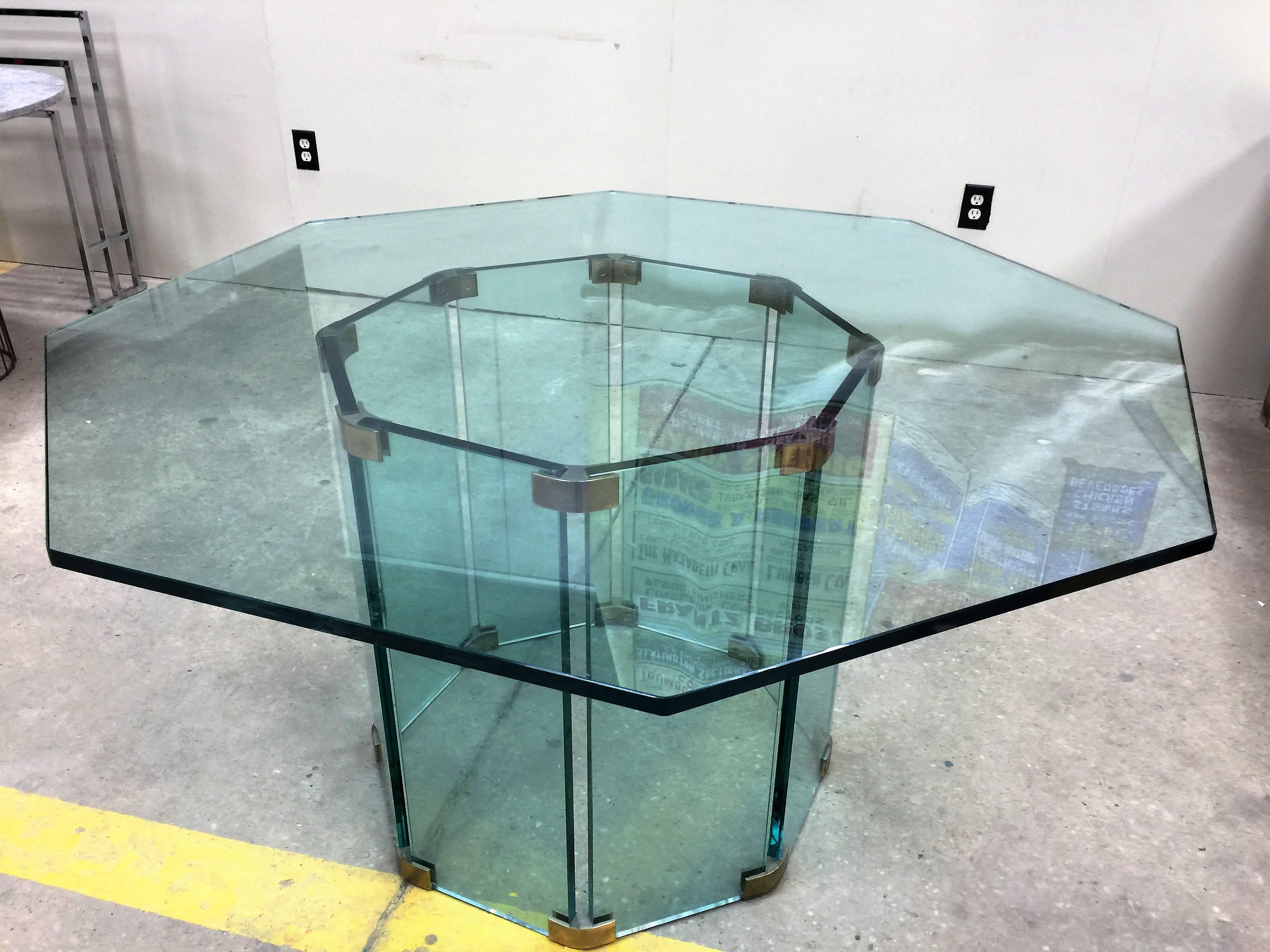 Amazing octagonal glass and chromed brass frame dining or center table.
This 1970s glass table designed by The Pace Collection. A substantial table that is suitable for many styles of interiors. The base size is 27
