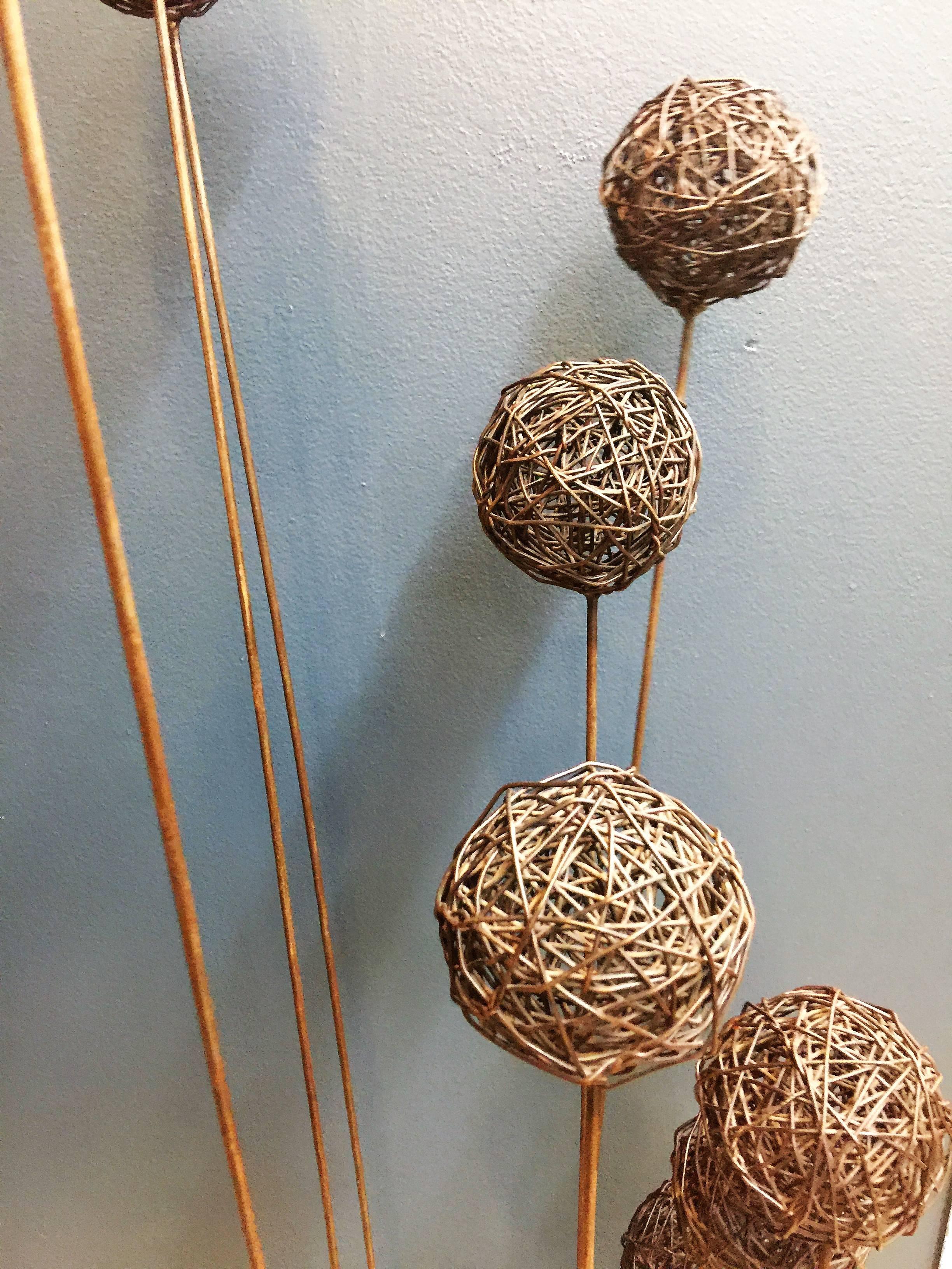 Interesting and modern metal nine wire ball form sculpture that has movement when touched, like the sonambient sculptures by sculptor Harry Bertoia.