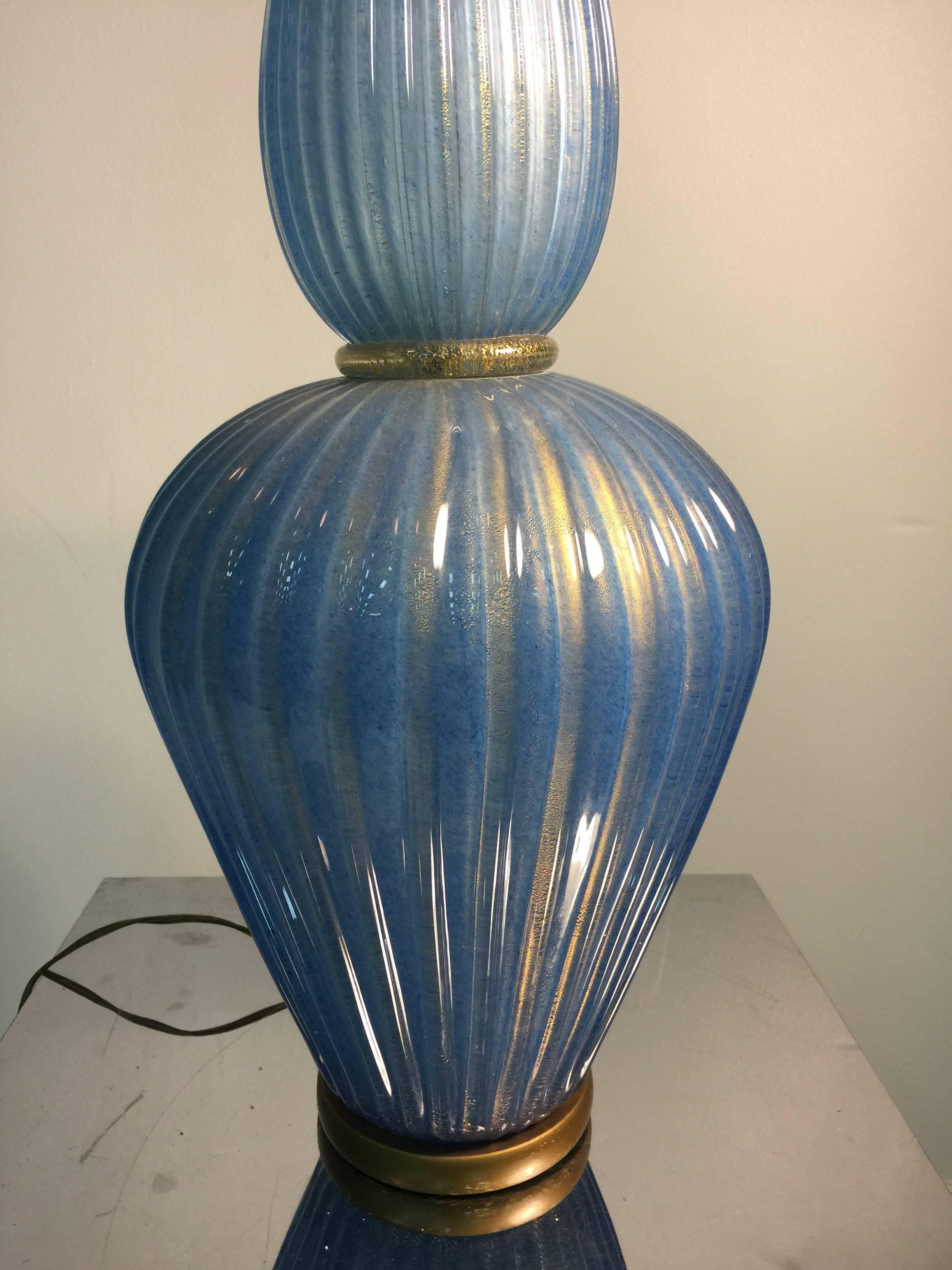 A Midcentury Italian giant decorator table lamp in blue Murano glass with gold flakes by Barovier, circa 1960.