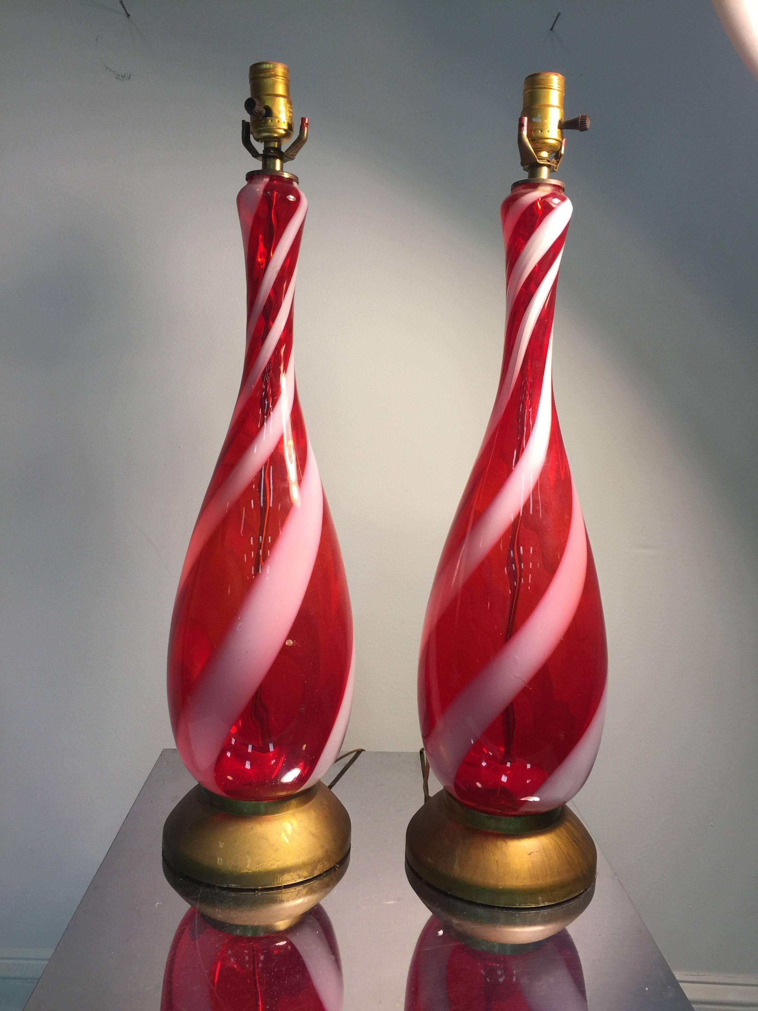 An exquisite pair of red and white stripe Murano glass Barovier table lamps, circa 1960.