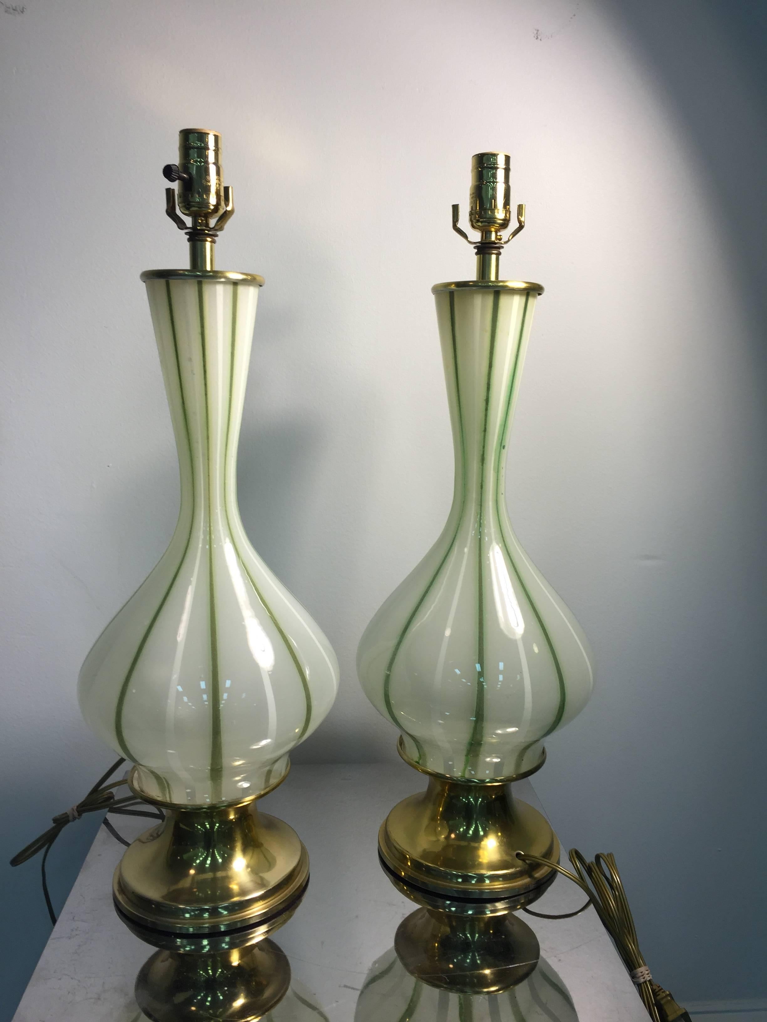A lovely pair of 1970s Italian Murano glass table lamps in white with green stripes.