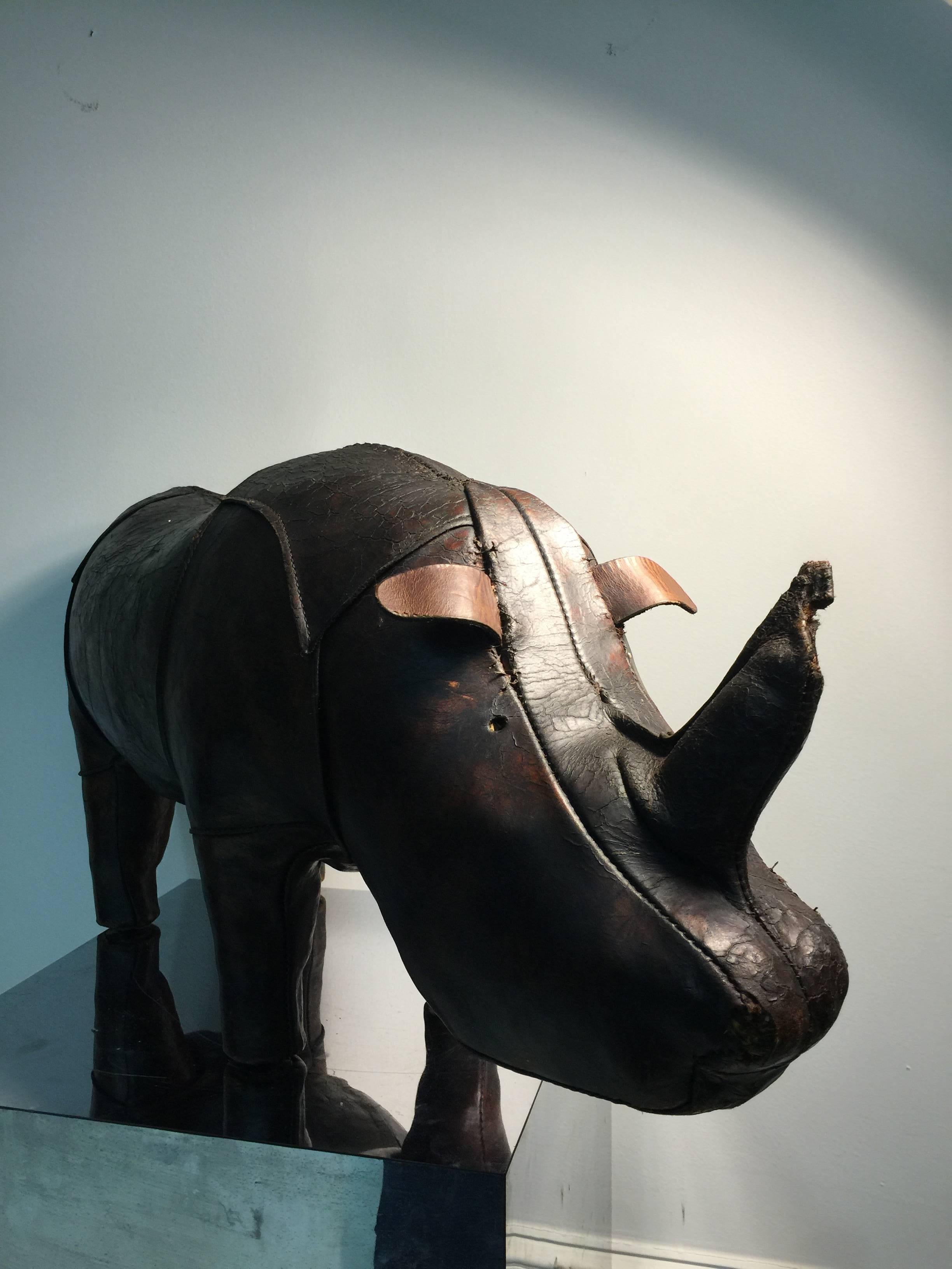 A magnificent and iconic vintage Abercrombie and Fitch leather rhino footstool, circa 1970 or earlier.