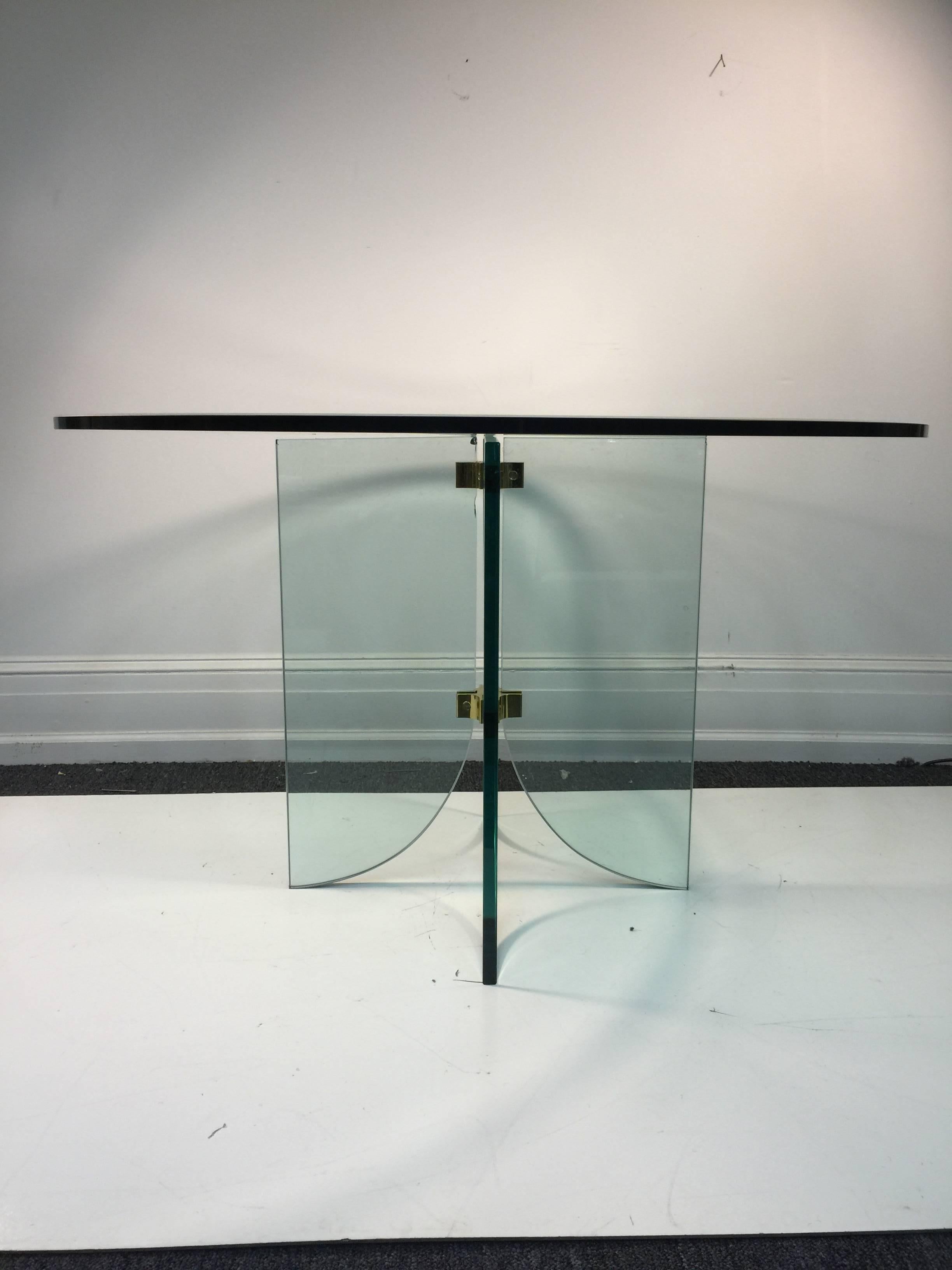 A phenomenal Leon Rosen for Pace Collection glass pedestal dining table with round top, circa 1970. Glass top is 48