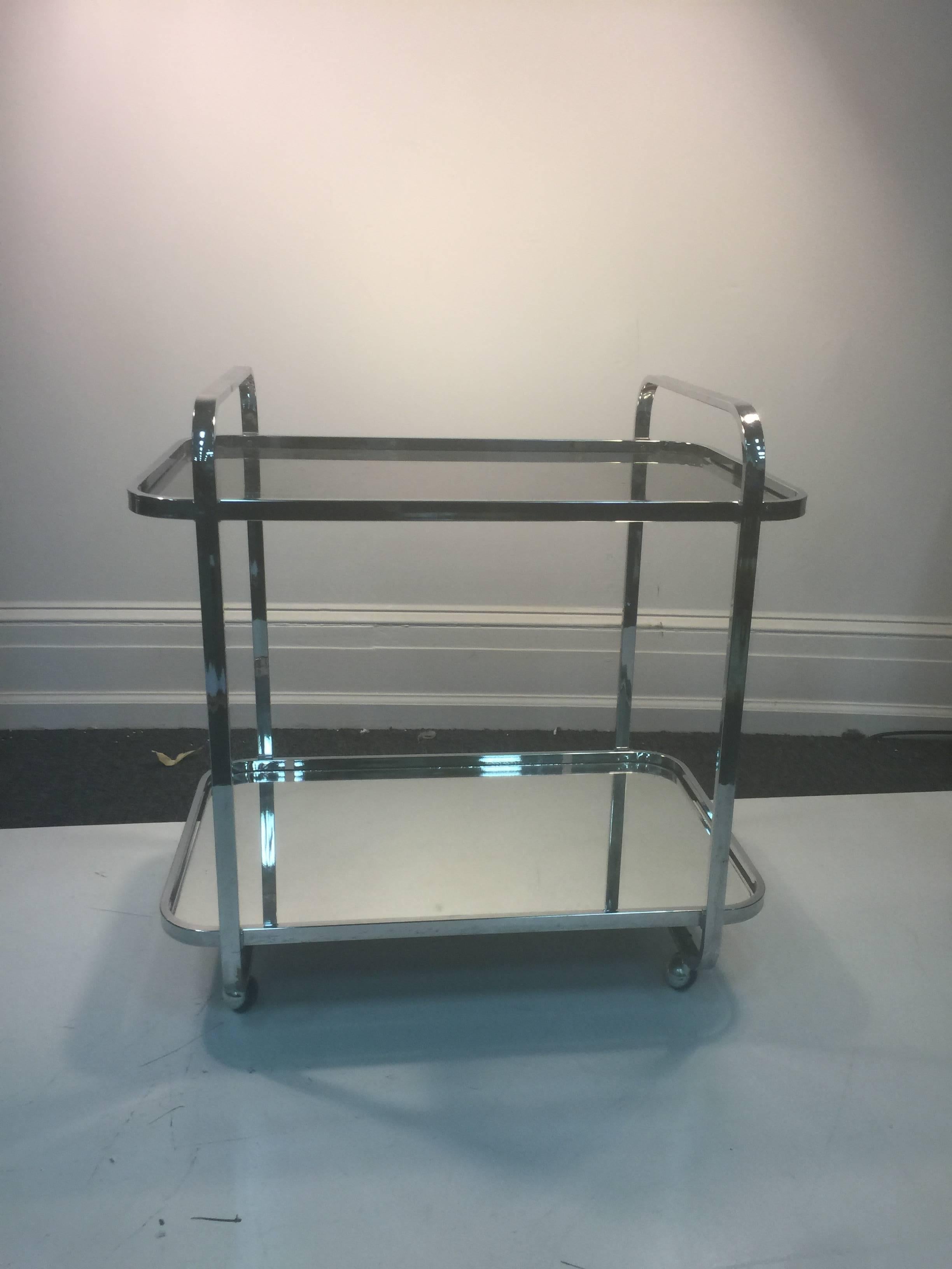 A magnificent modern two-tier chrome tea cart by Milo Baughman, circa 1970.