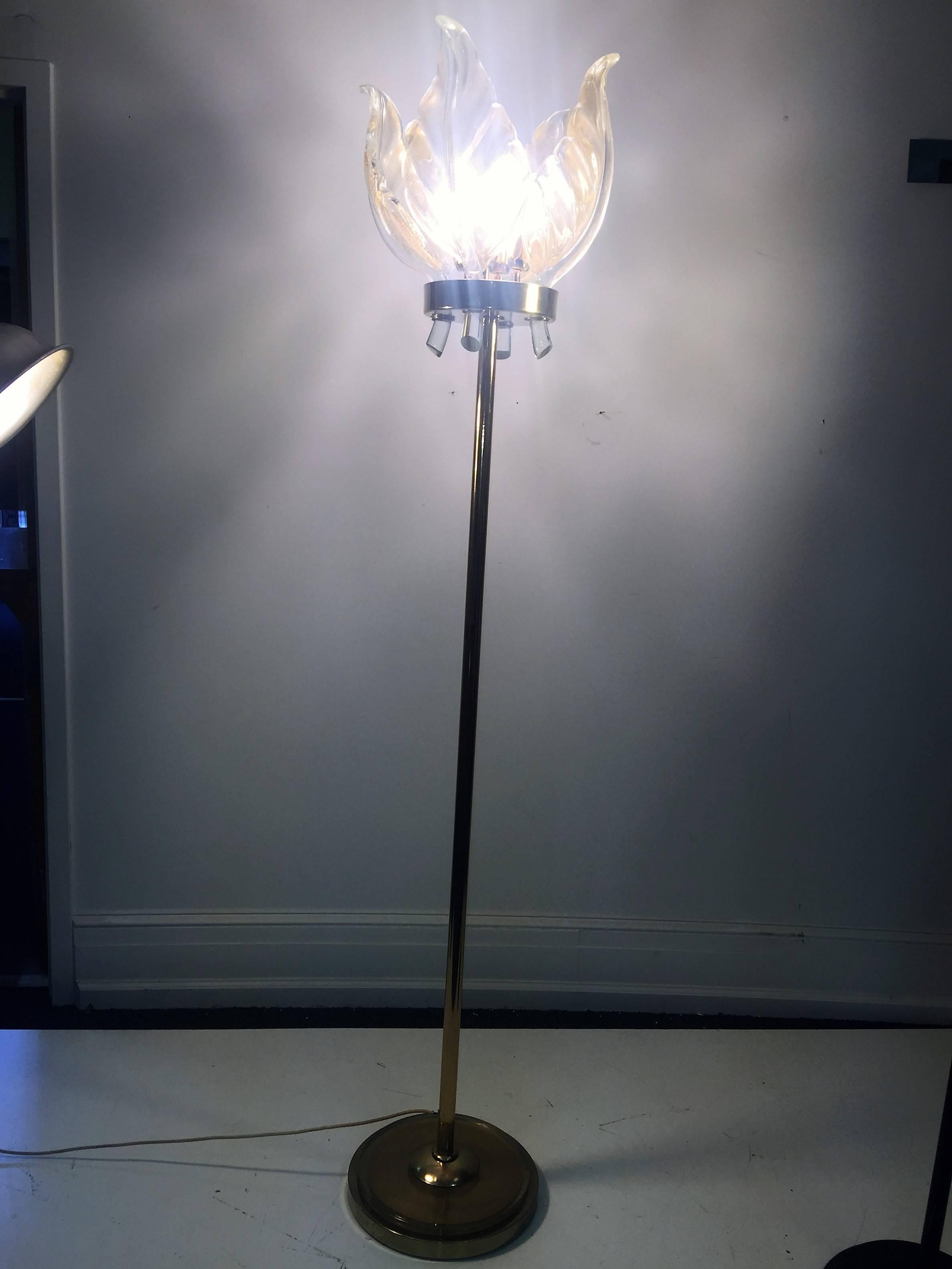 Rare design solid polished brass Murano glass floor lamp with round Murano glass base and four substantial handblown leaf form shades that slip into holders at the top of the lamp surrounding the light fixtures. Designed and created by Venini this