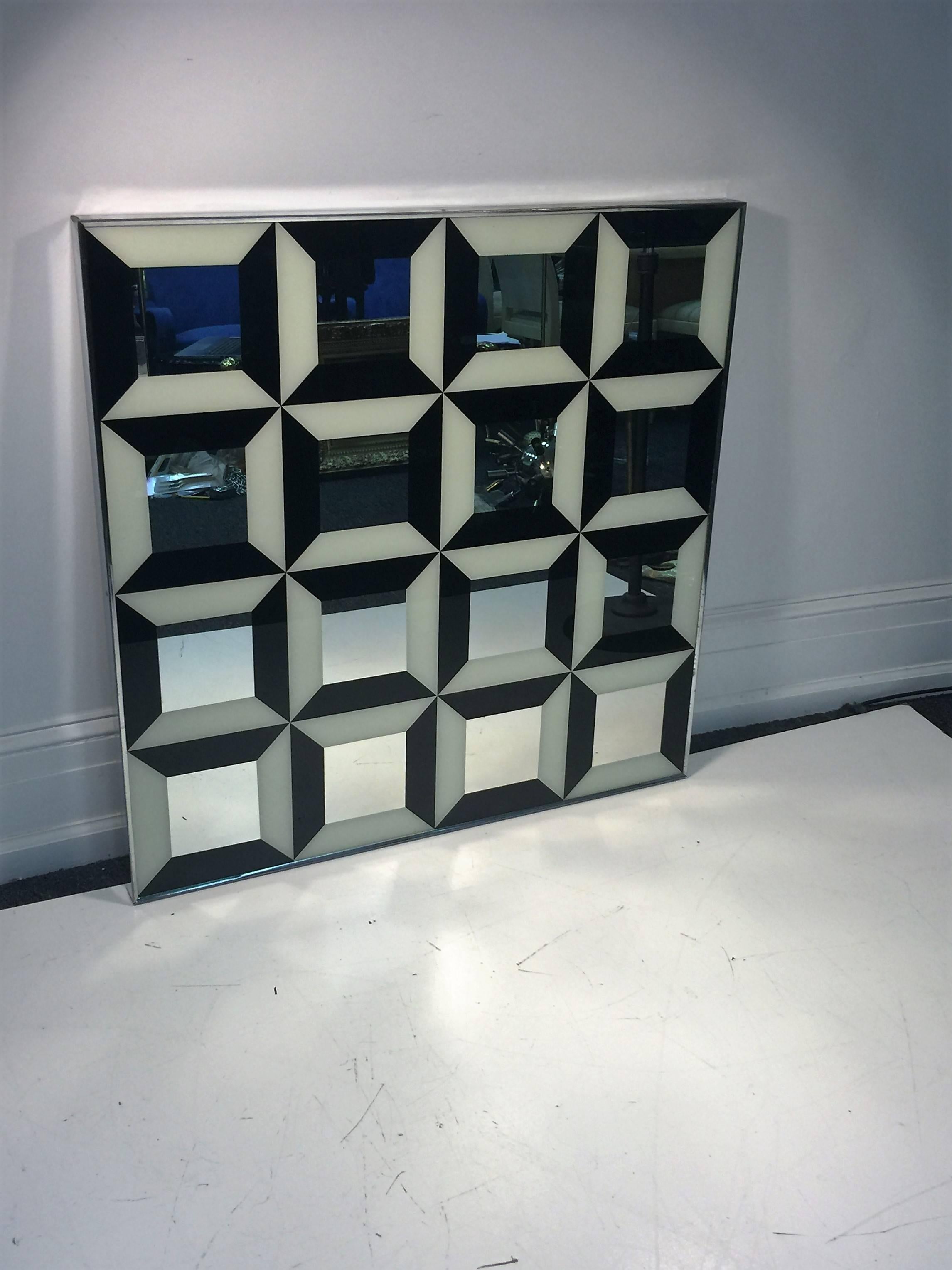Great Pop Art reverse painted 1970s mirror designed by Verner Panton.
Substantial square mirror that would add drama and depth to any wall in a modern interior.