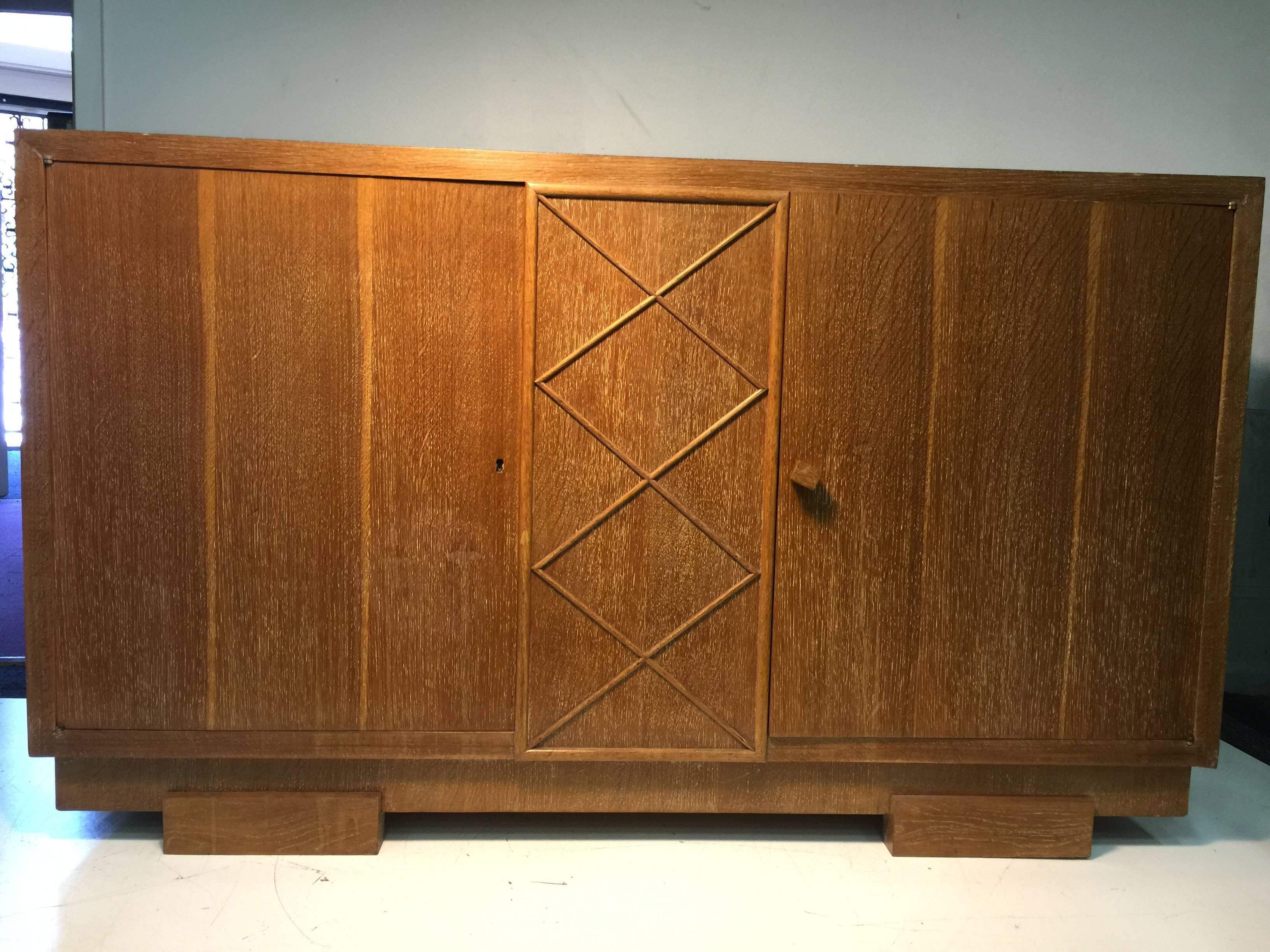 An unusual 1950s French sideboard or cabinet in cerused oak attributed to Jacques Adnet.