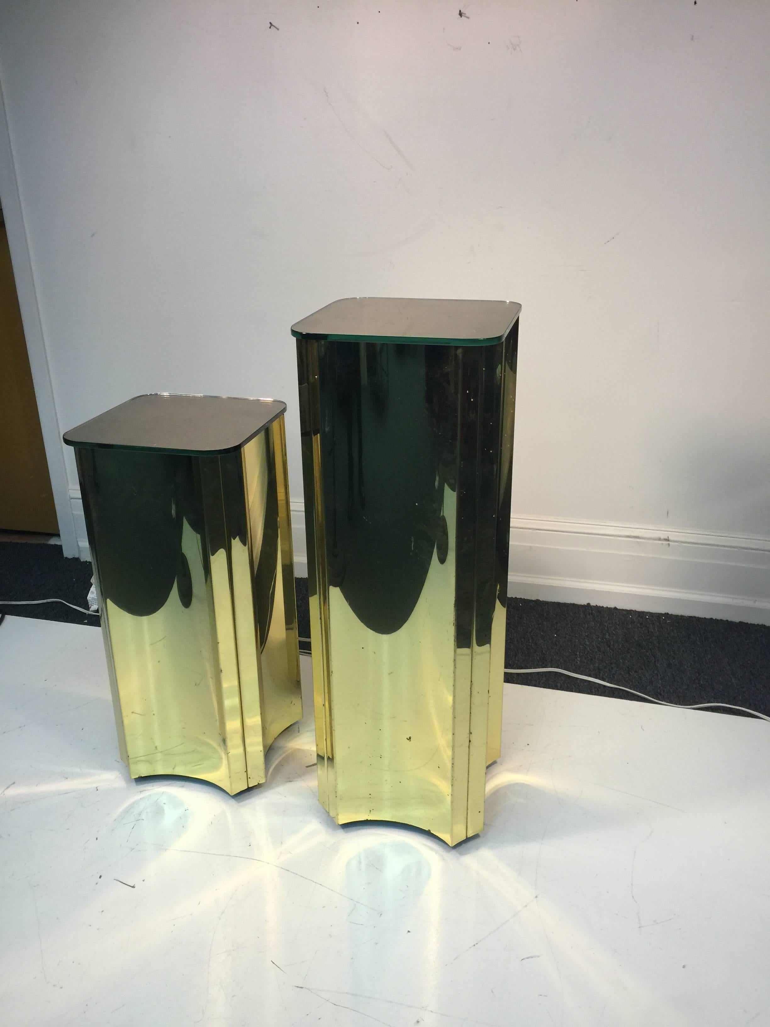 A terrific set of two sculptural brass pedestals with mirrored tops signed, Curtis Jere and dated 1984.

Dimensions:

Larger 36